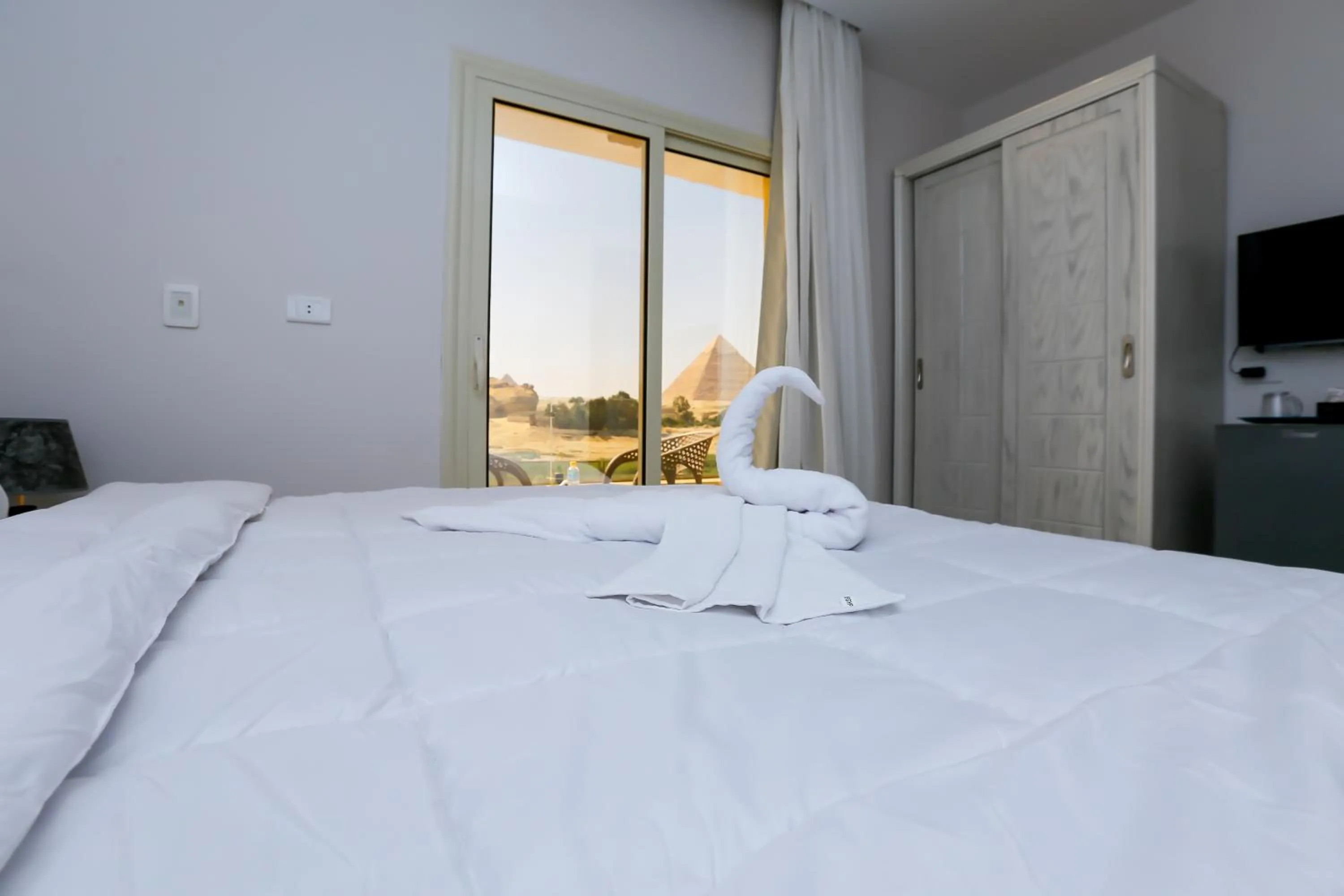 Bed in Pyramids Land Hotel