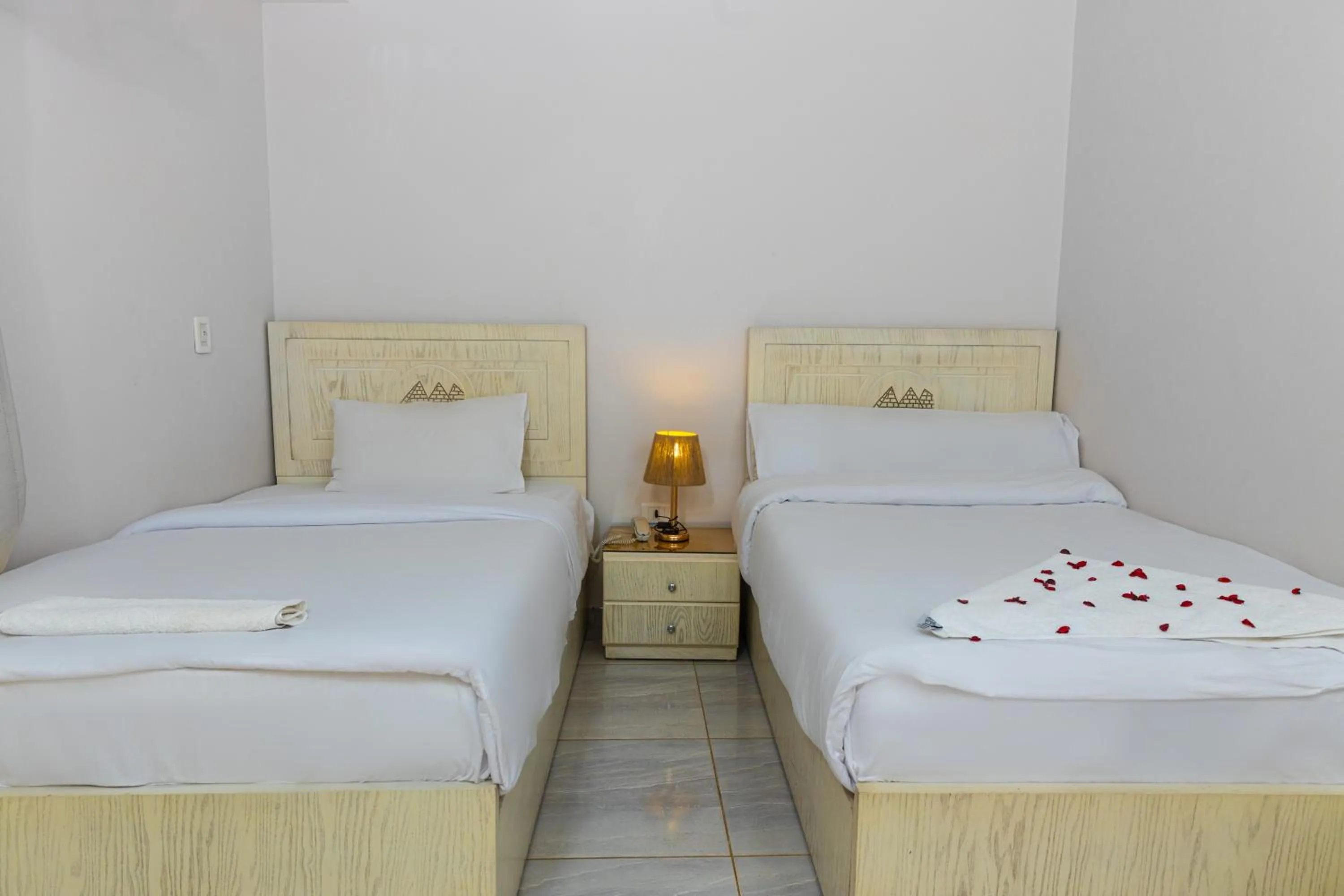 Bed in Pyramids Land Hotel