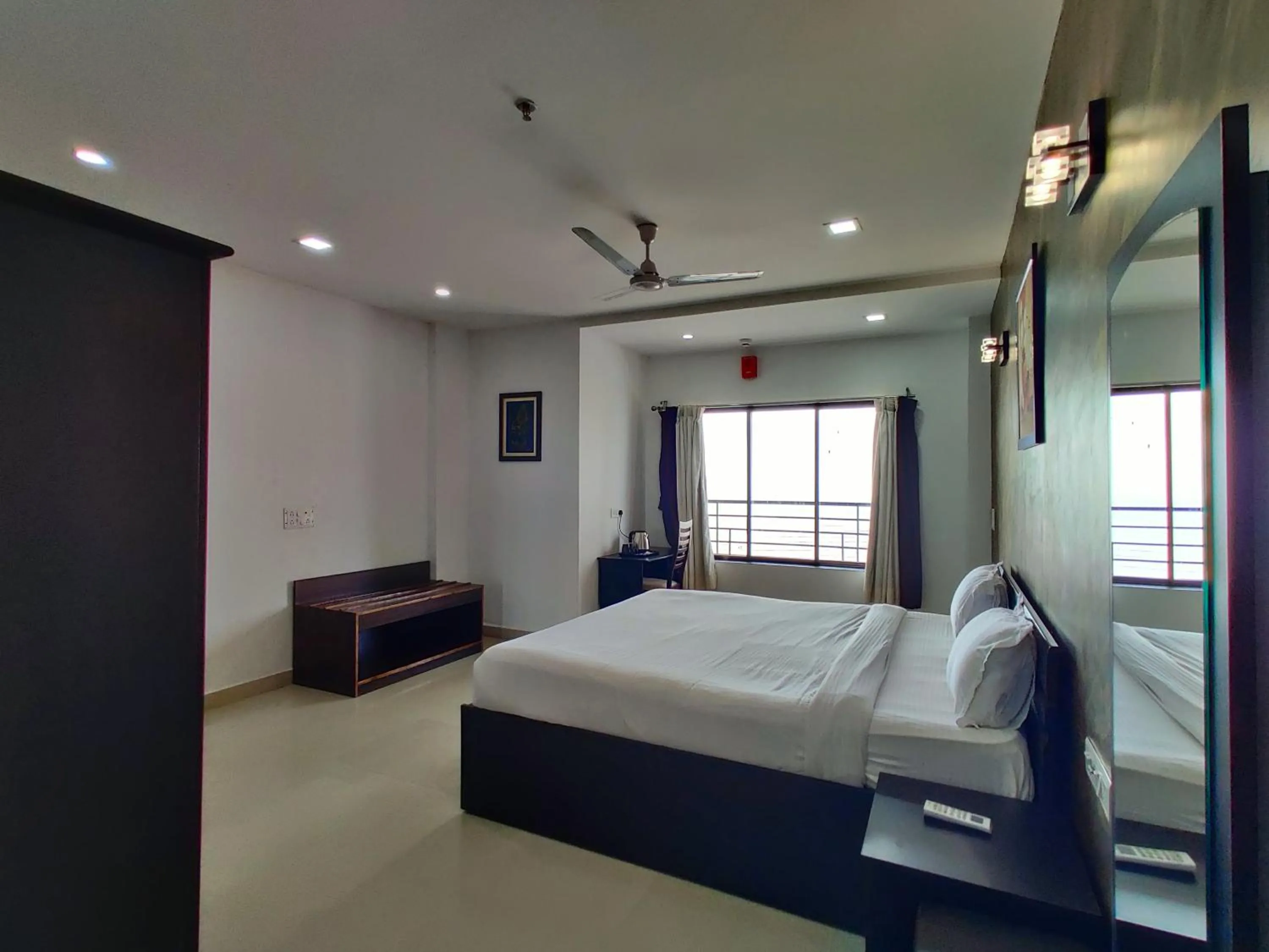 Bed in Golden Chariot Hotel Daman