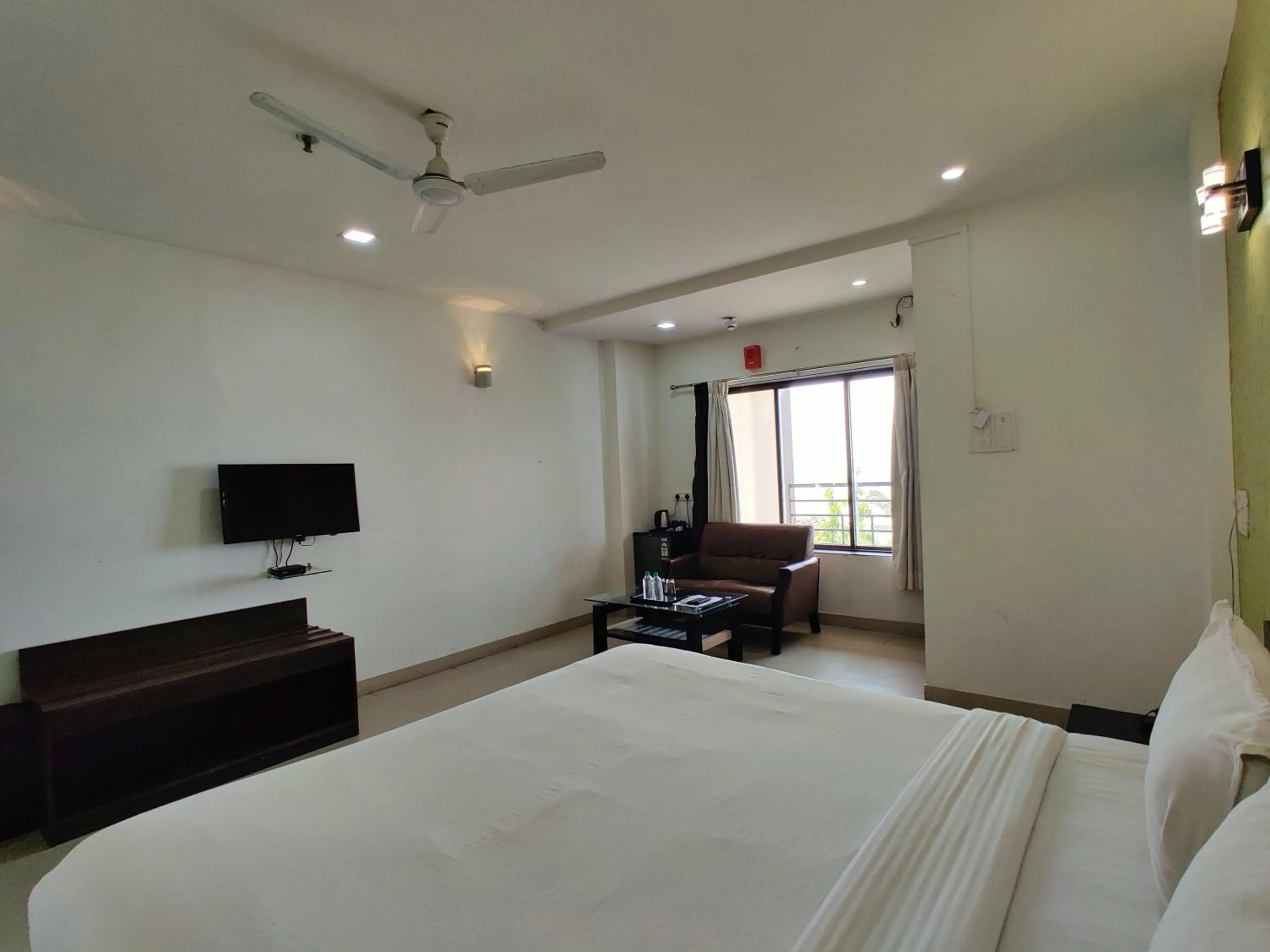 Bed in Golden Chariot Hotel Daman