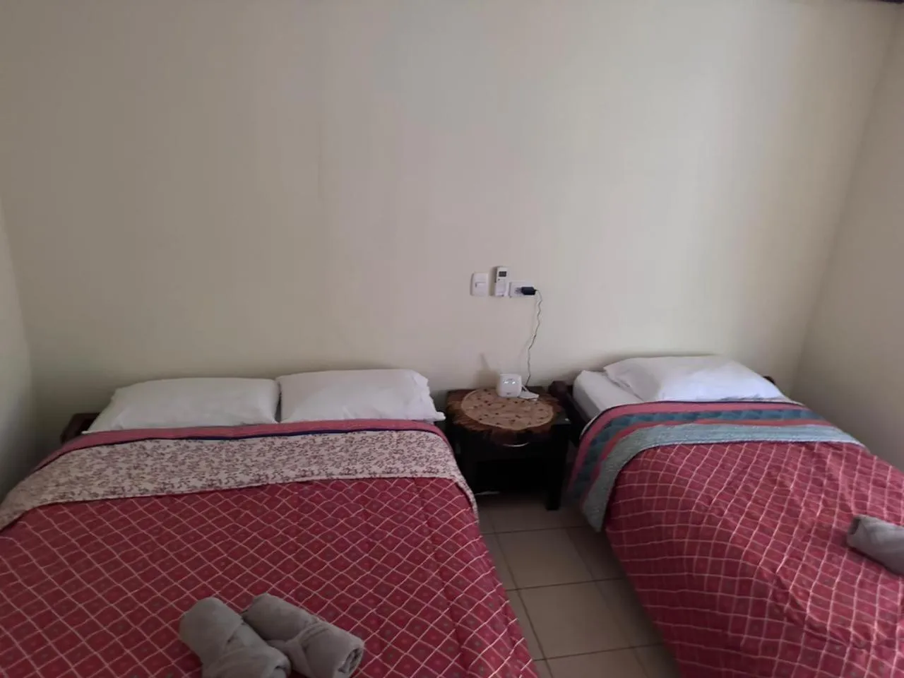 Bed in RIVER SIDE LODGE