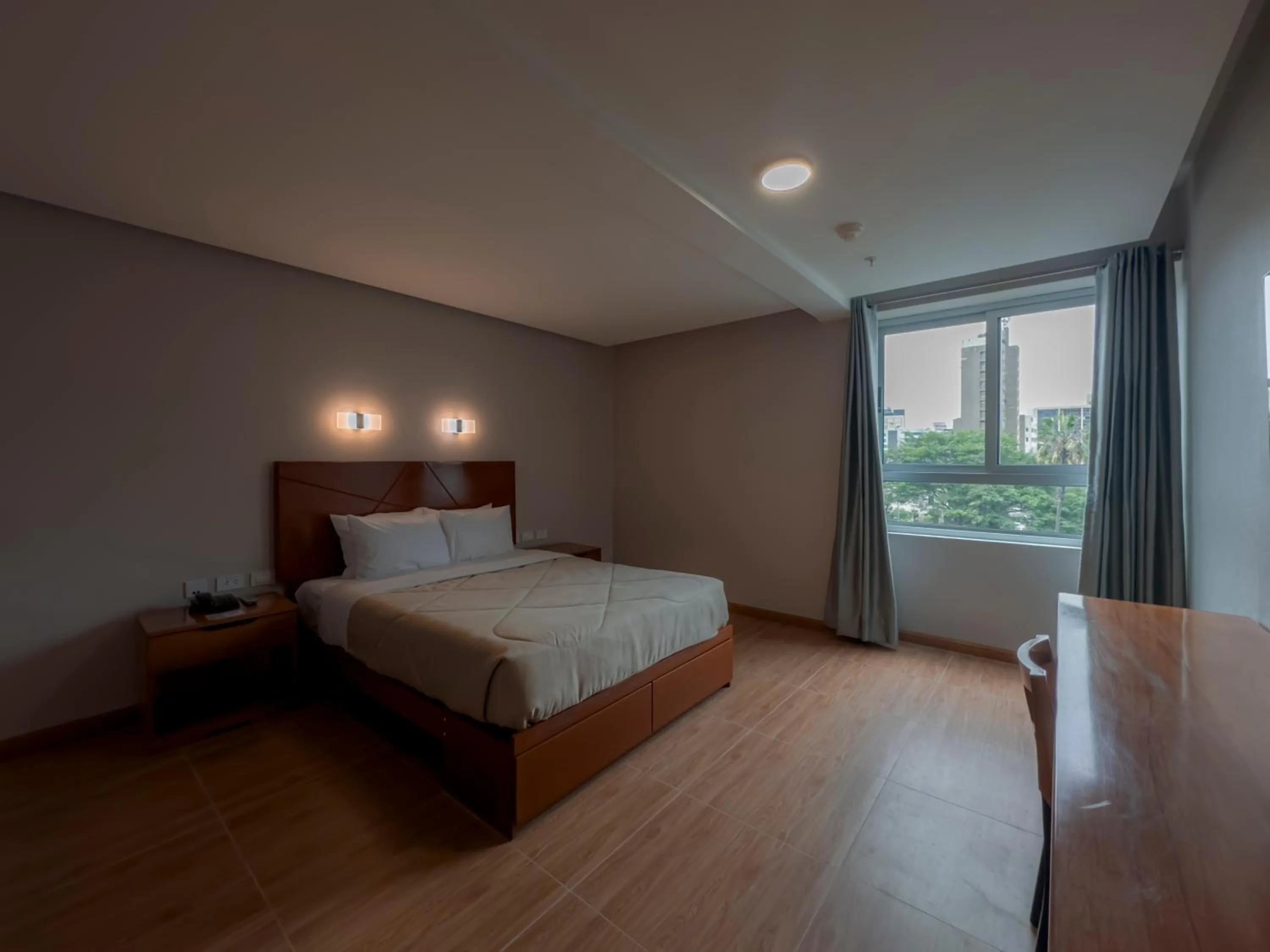 Bed in MIRAFLORES CITY HOTEL