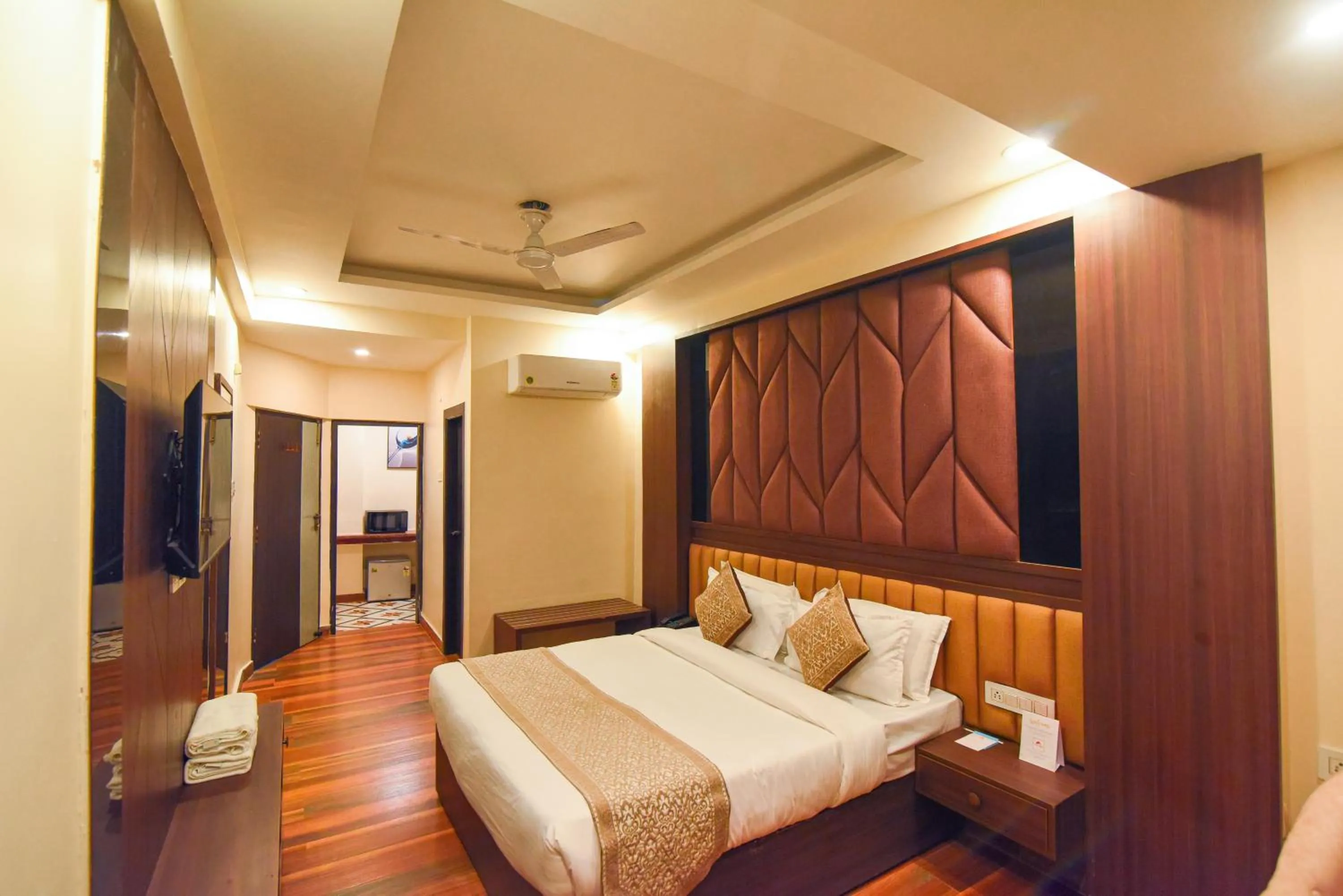 Bed in Hotel Swagat Suites