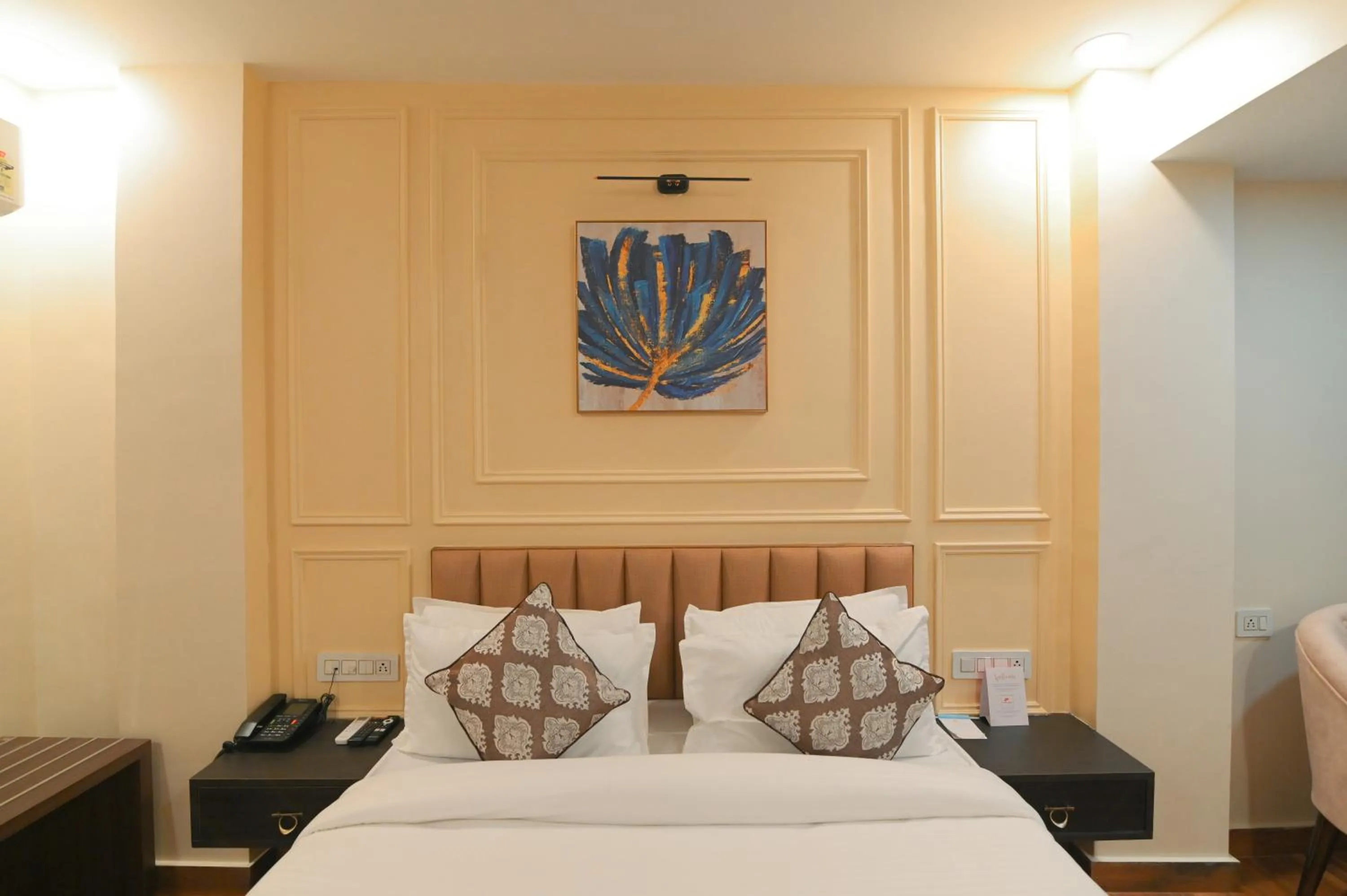 Bed in Hotel Swagat Suites