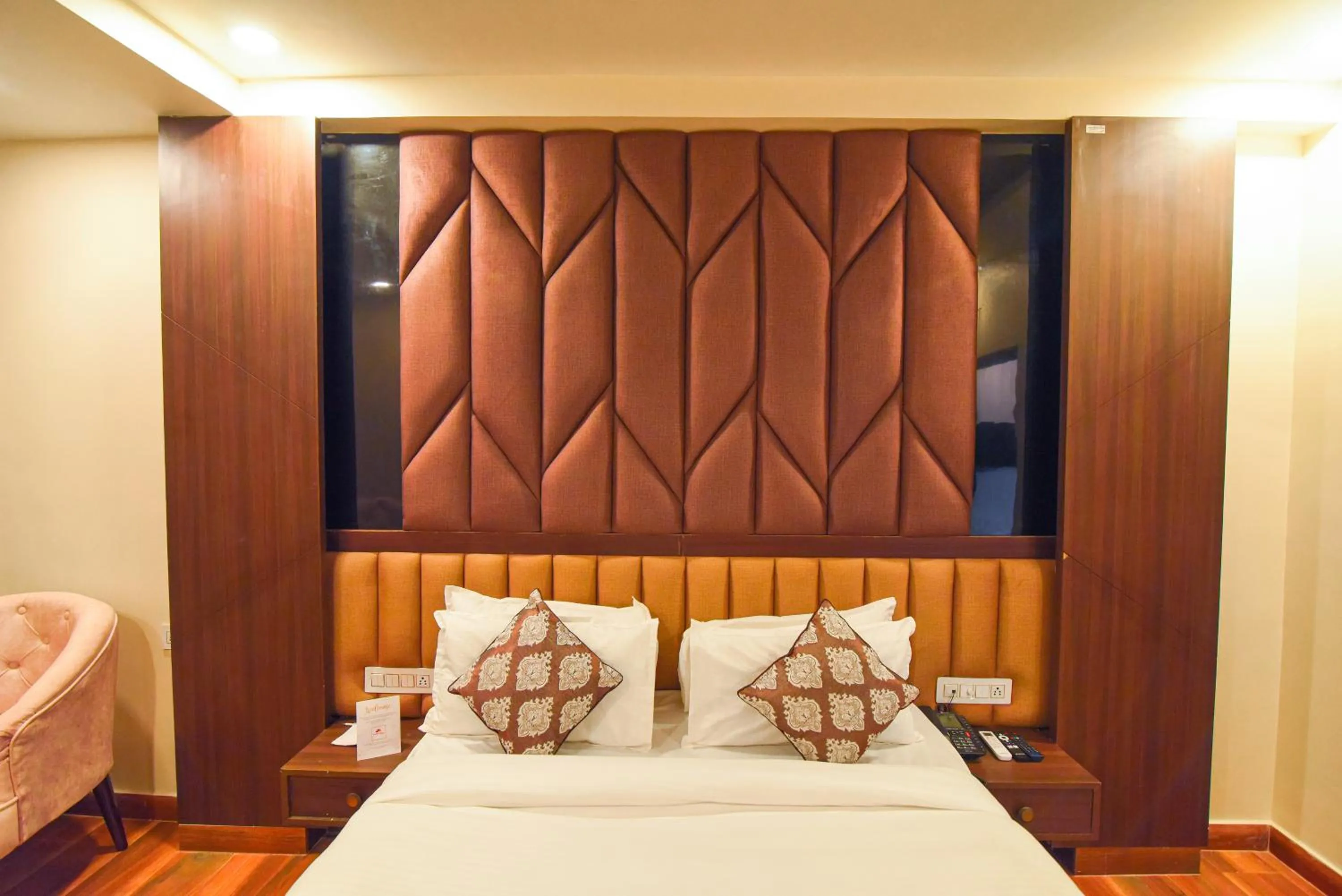 Bed in Hotel Swagat Suites