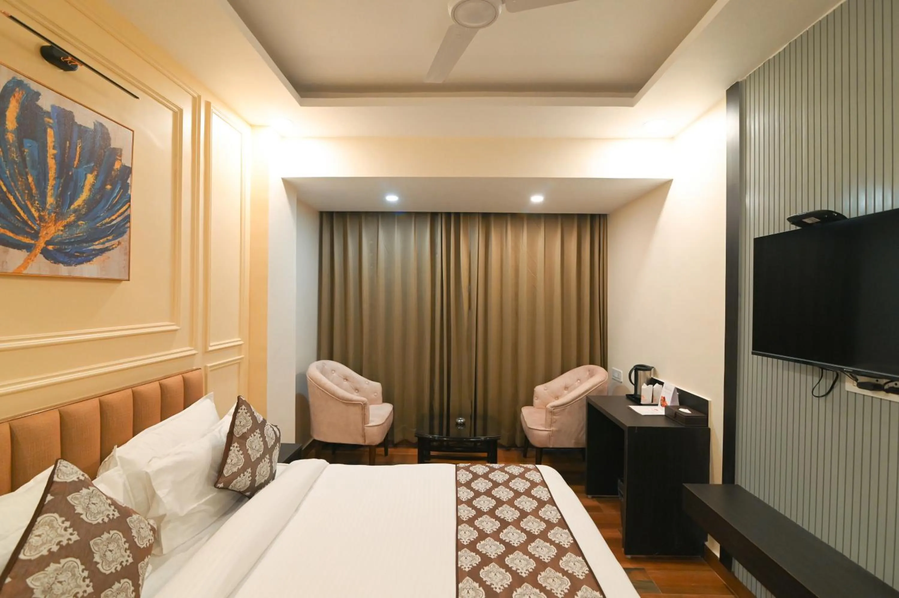 Seating area, Bed in Hotel Swagat Suites