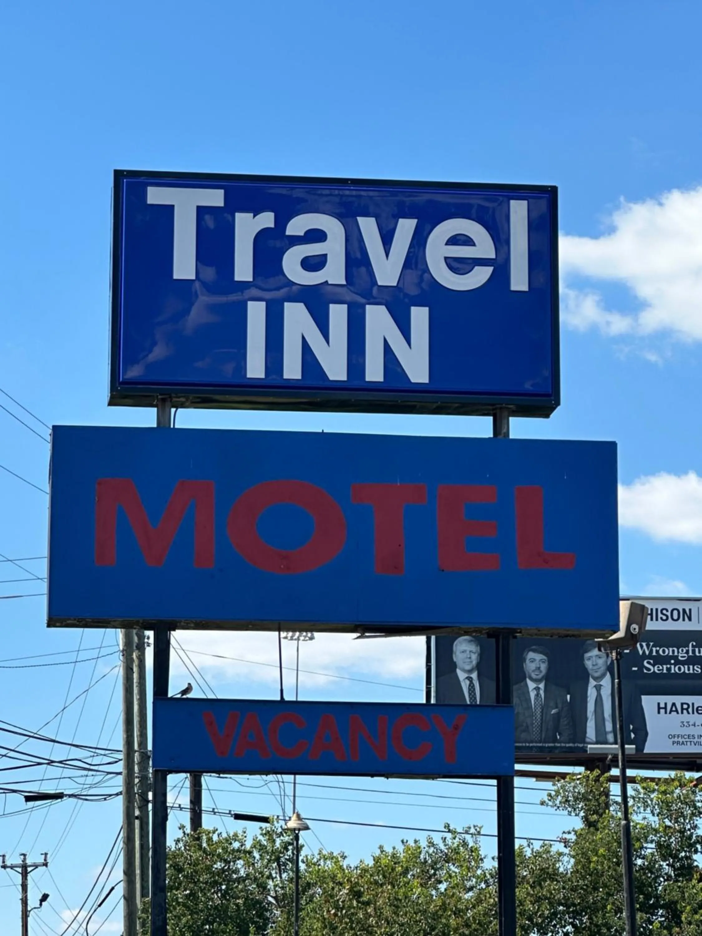 Property logo or sign in Travel Inn Montgomery AL