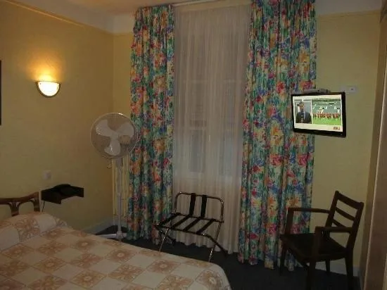 Bed in Hôtel de la cloche