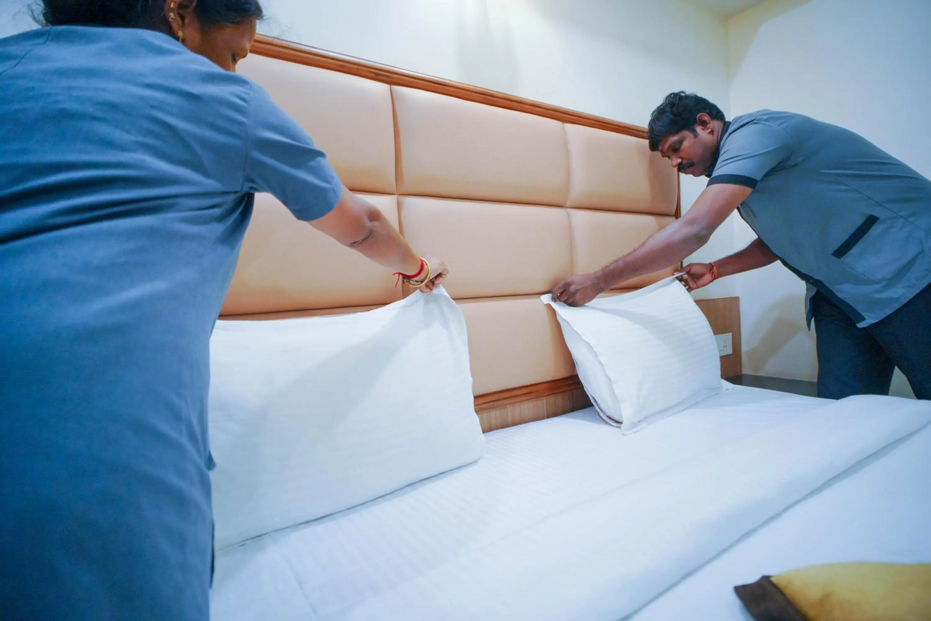 Bed in Hotel Grand Sabarees