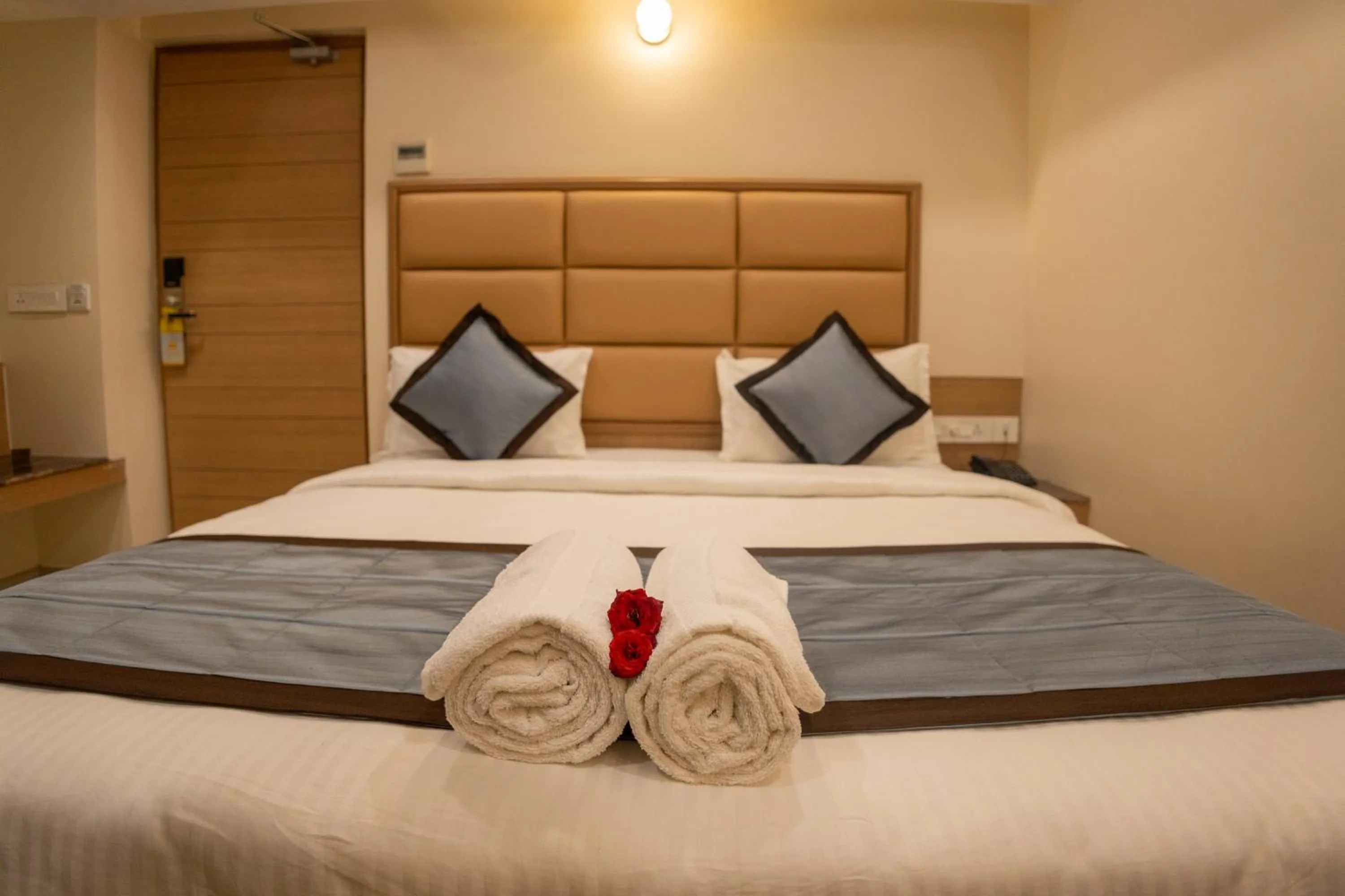 Bed in Hotel Grand Sabarees