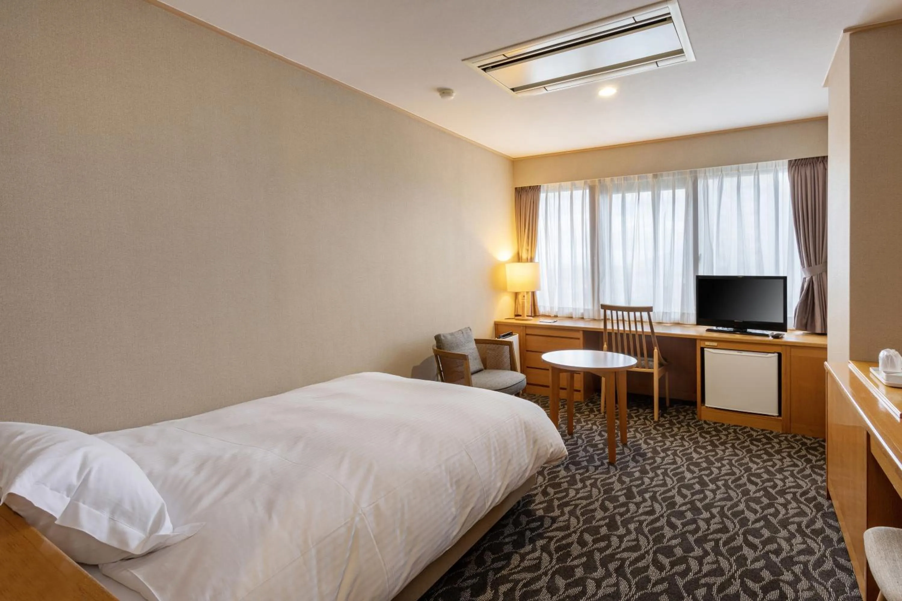 Bed in Suikouen Hotel