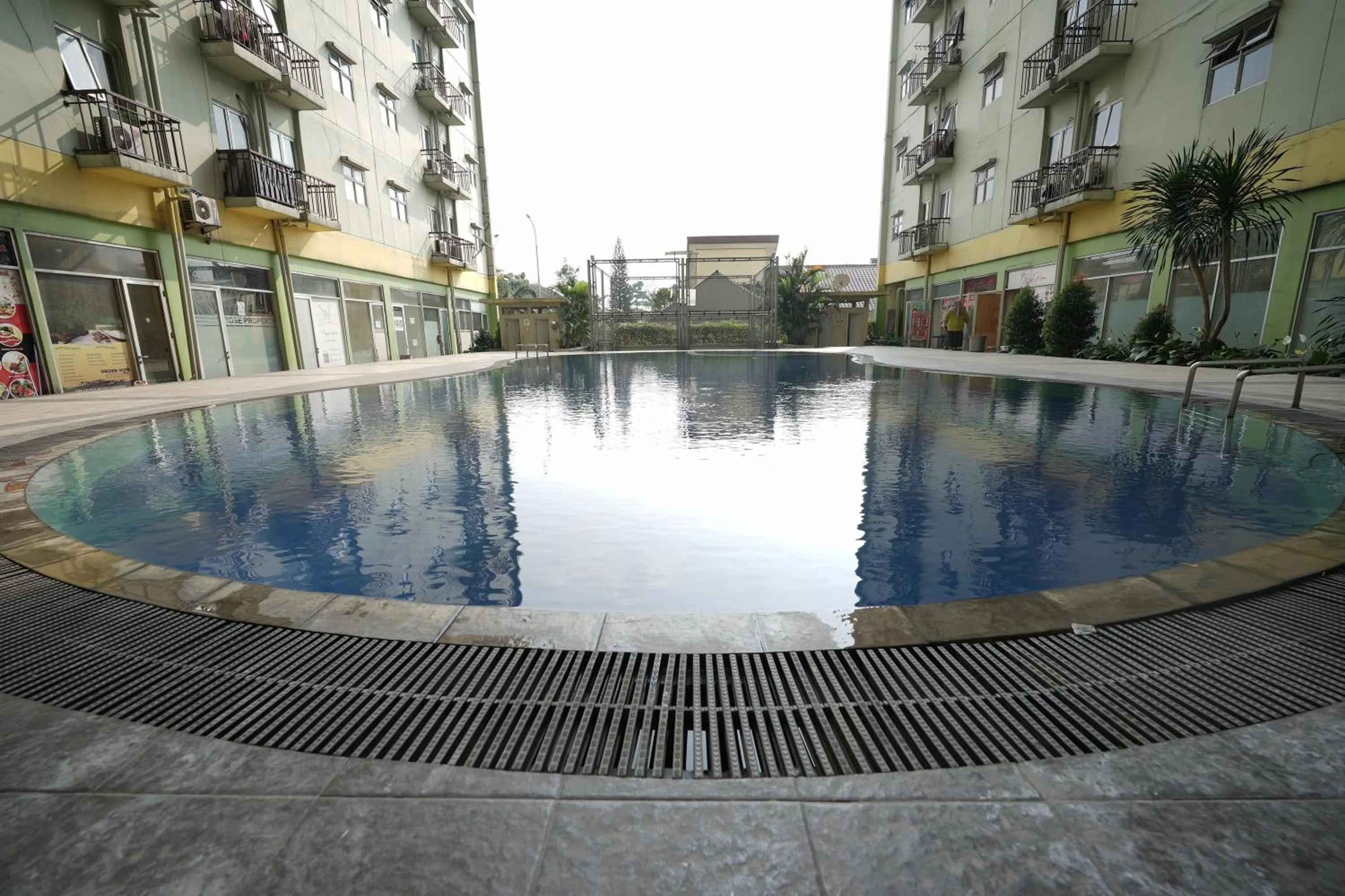 Swimming pool in Perfect Stay Apartement The Suites Metro Bandung By Sultan Property