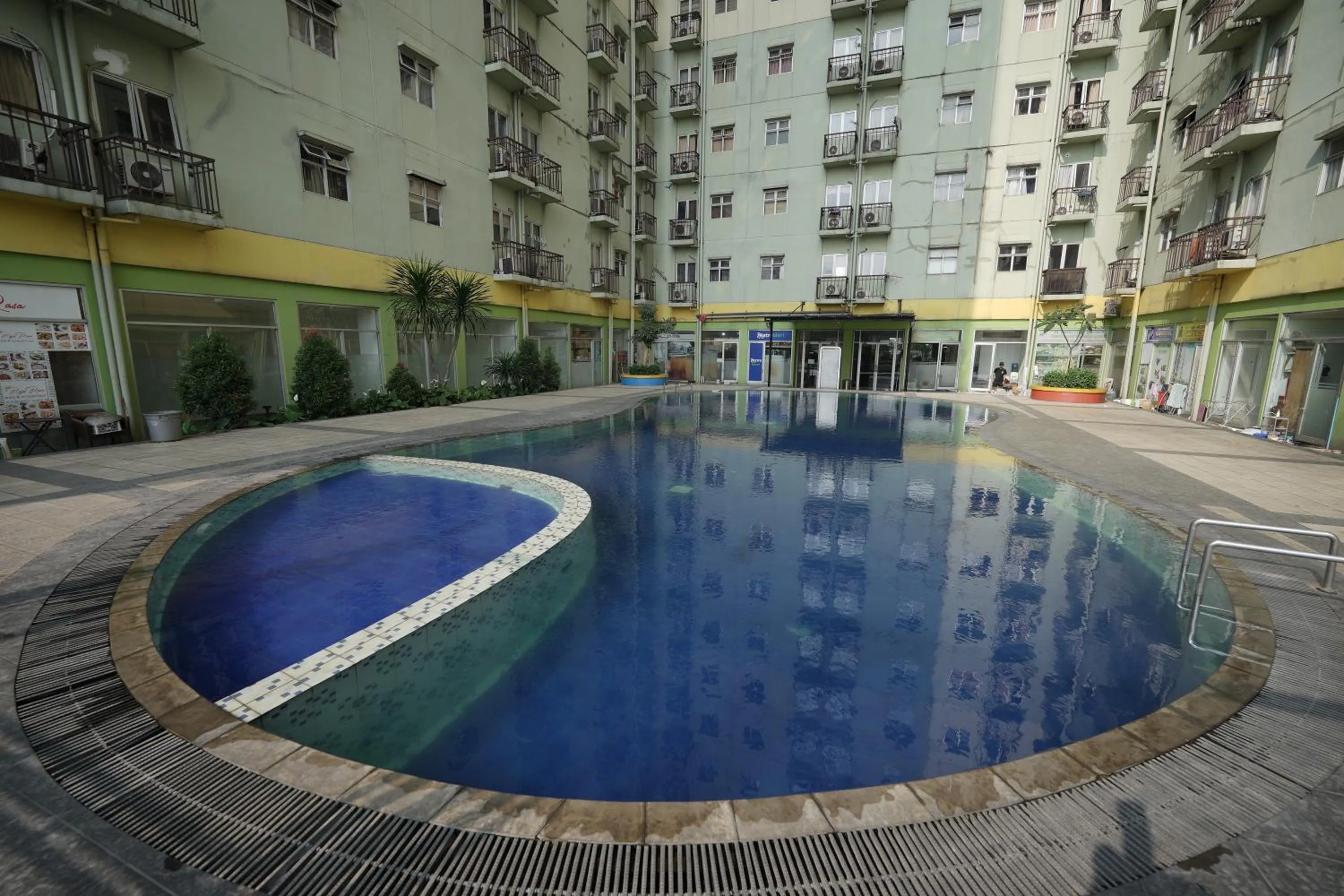 Swimming pool in Perfect Stay Apartement The Suites Metro Bandung By Sultan Property