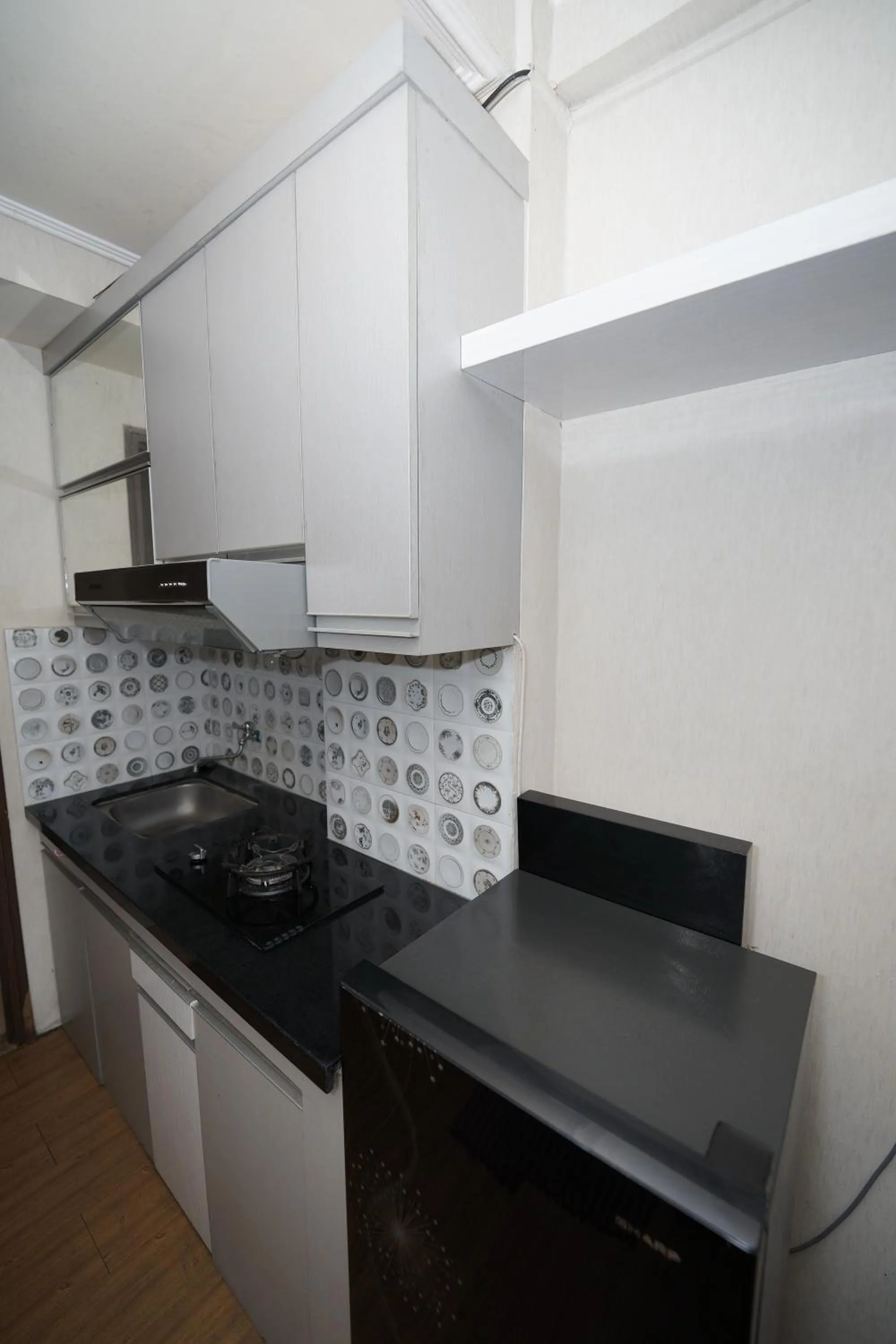kitchen in Perfect Stay Apartement The Suites Metro Bandung By Sultan Property
