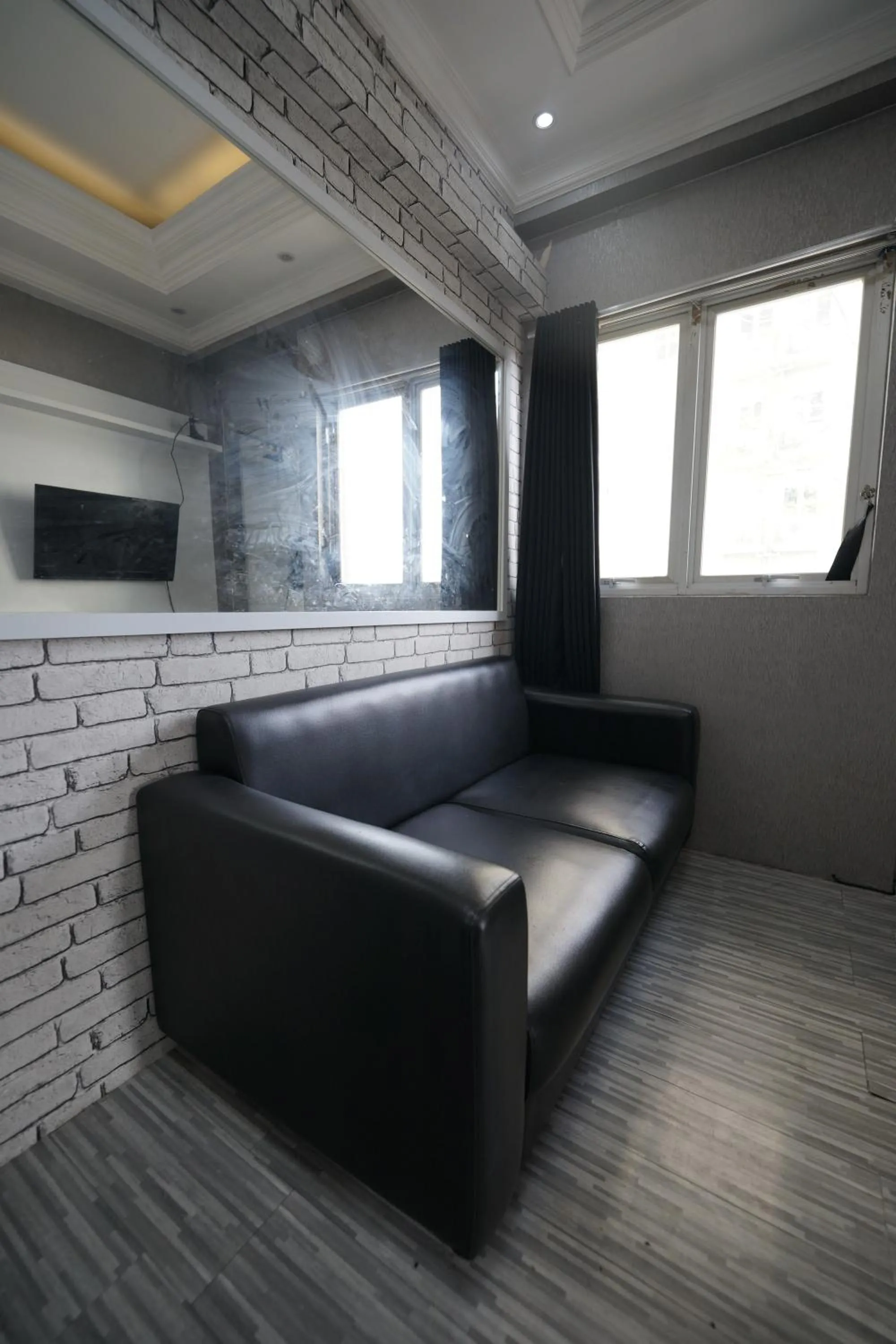 Living room in Perfect Stay Apartement The Suites Metro Bandung By Sultan Property
