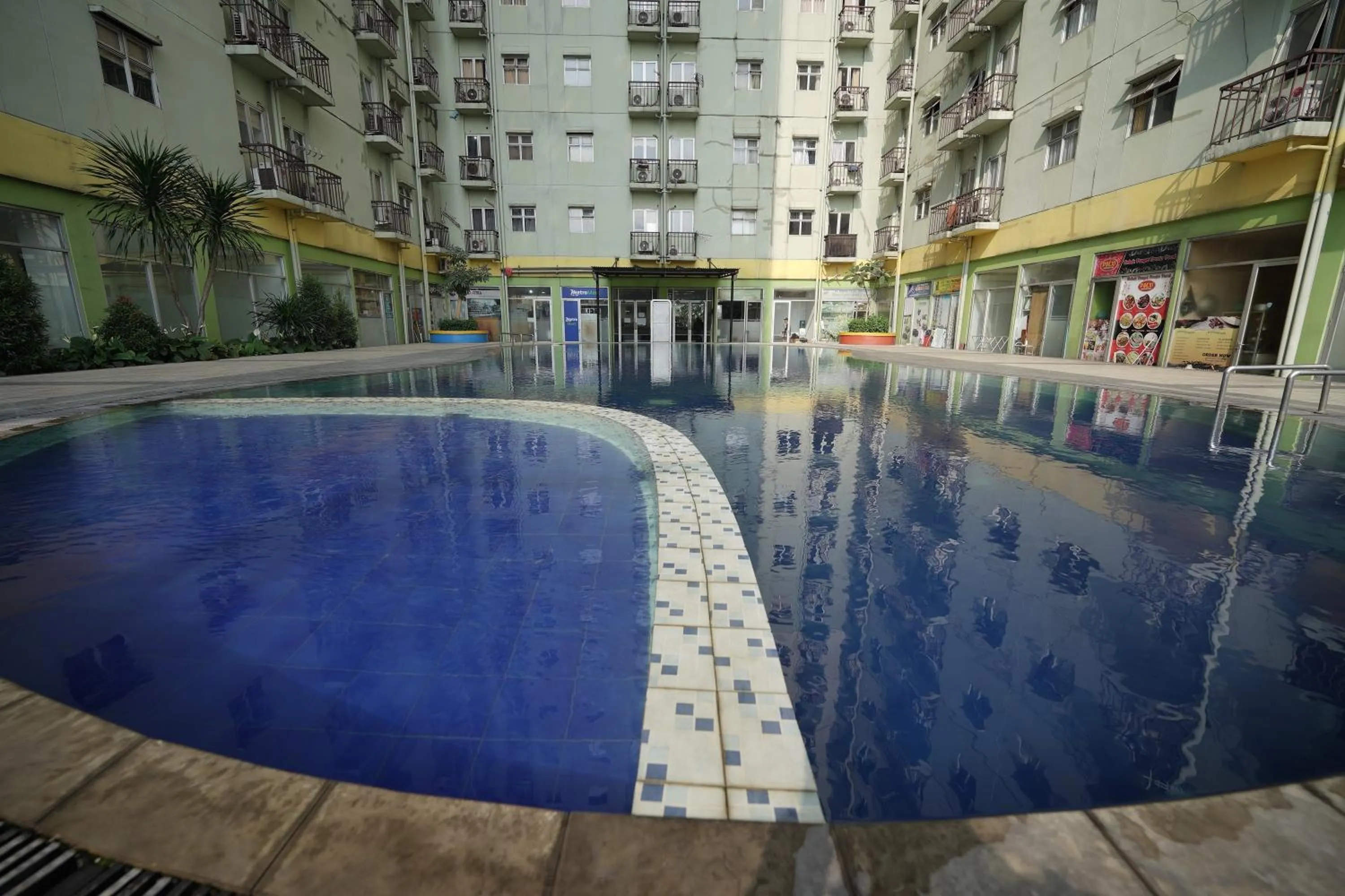 Swimming pool in Perfect Stay Apartement The Suites Metro Bandung By Sultan Property