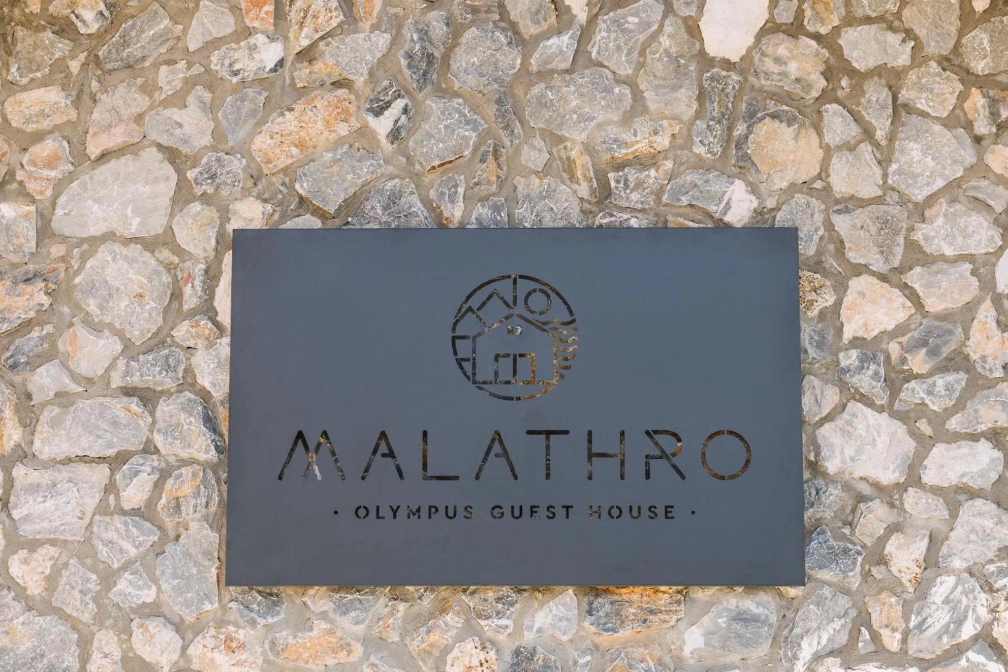 Text overlay in Malathro Olympus Guest House