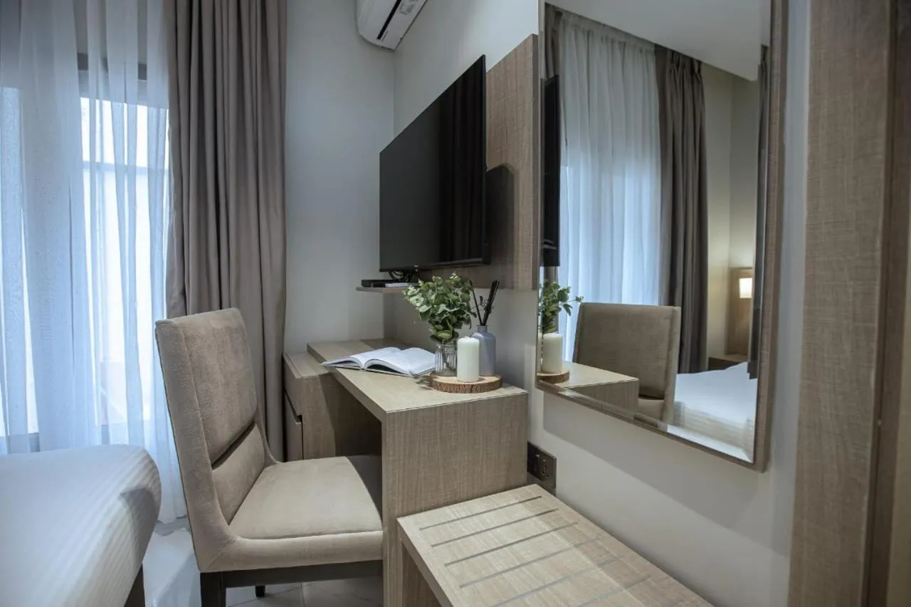 Bed in Knightsbridge Hotel & Suites