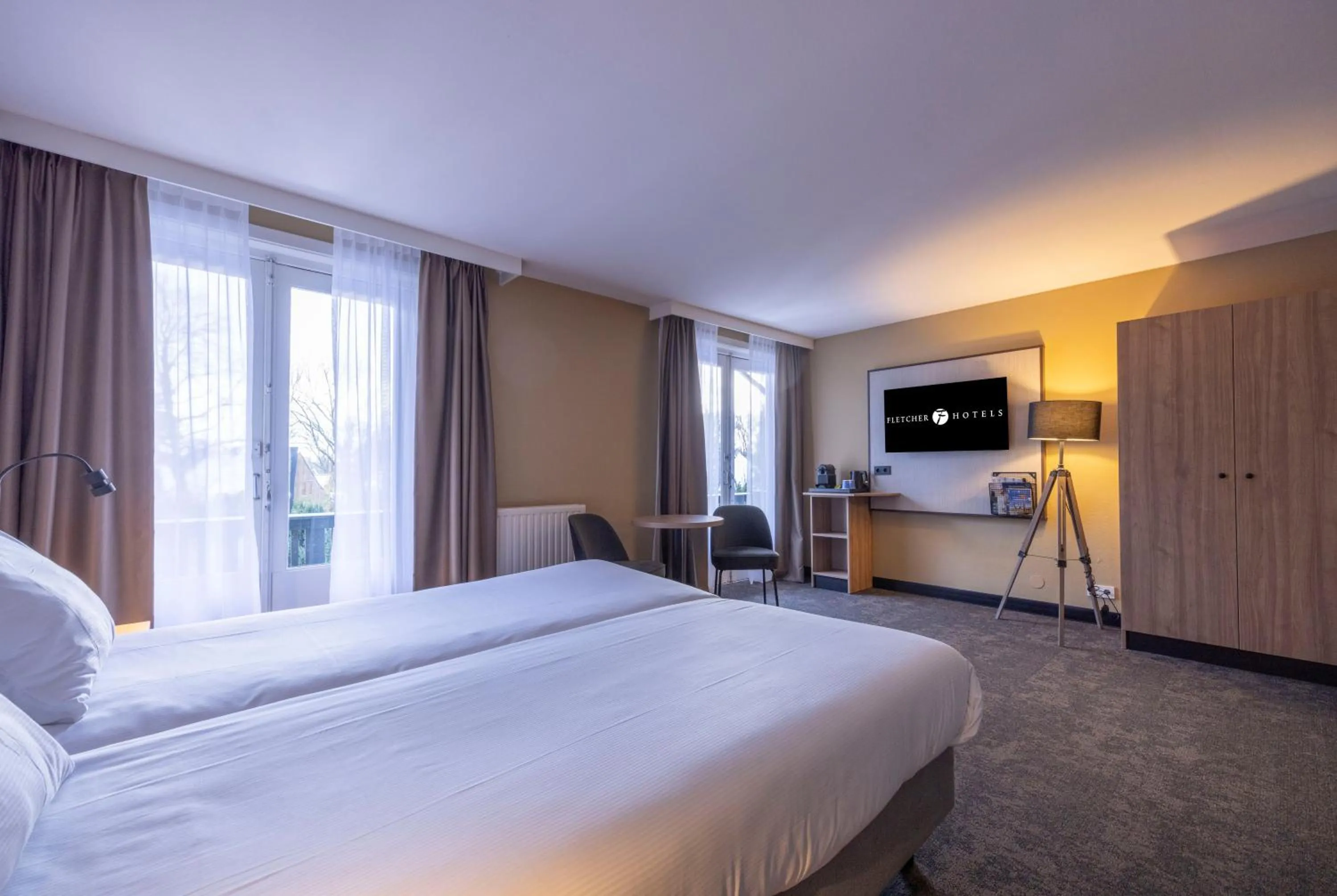 Bed in Fletcher Hotel-Restaurant Klein Zwitserland