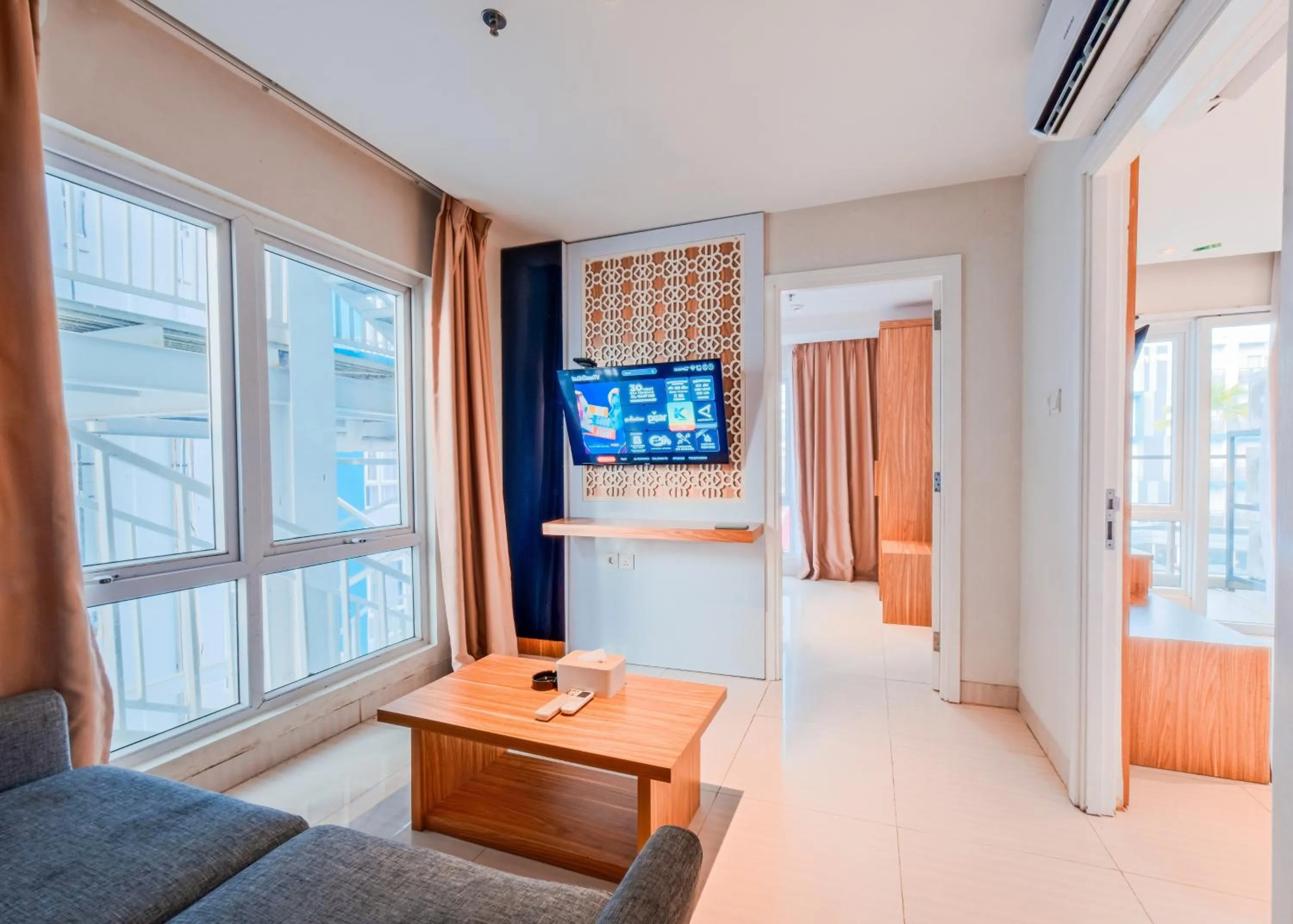 Living room, Bed in Astara Hotel Balikpapan