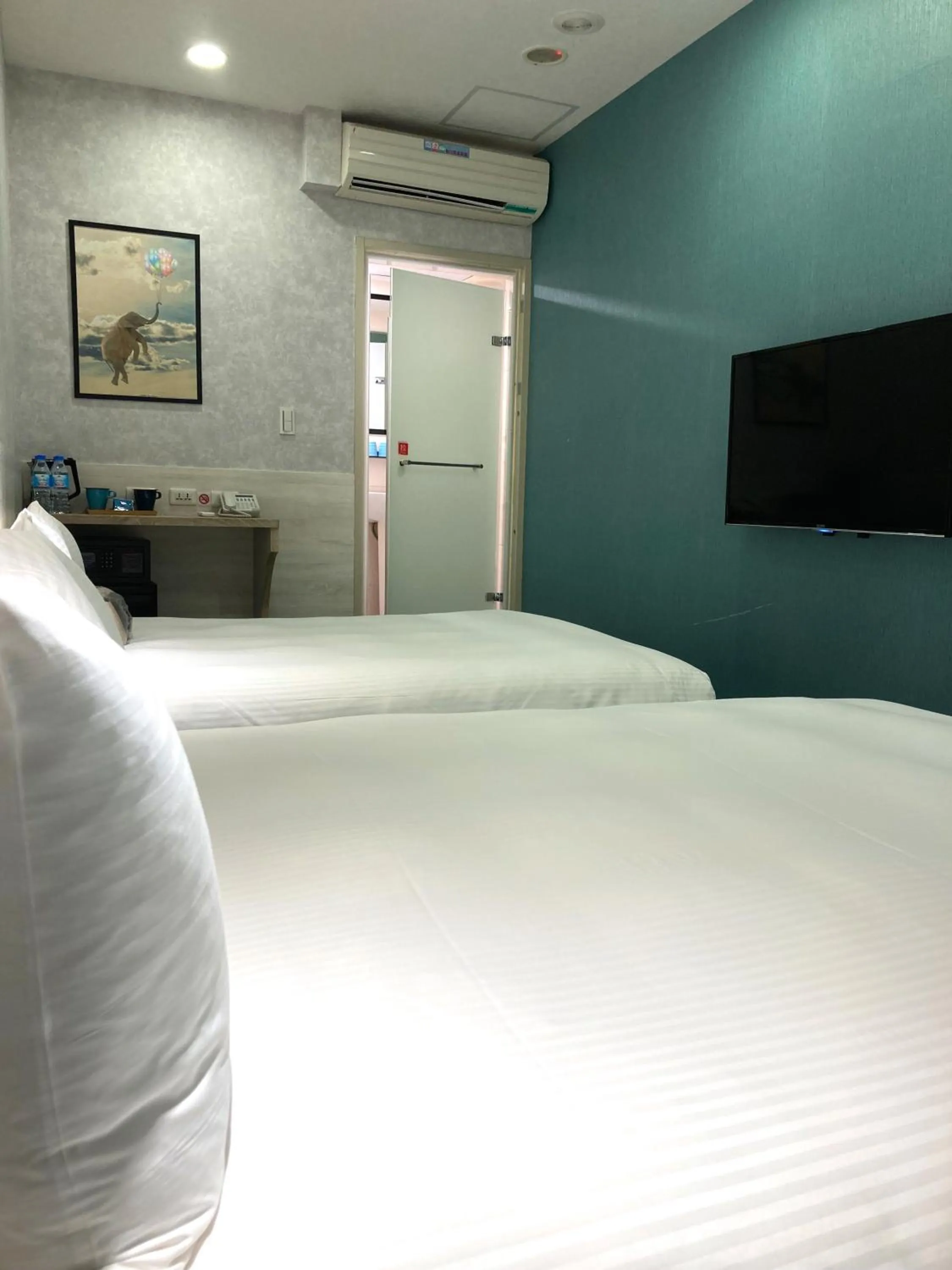 Bed in 西門雲町旅店 Sky Gate Hotel