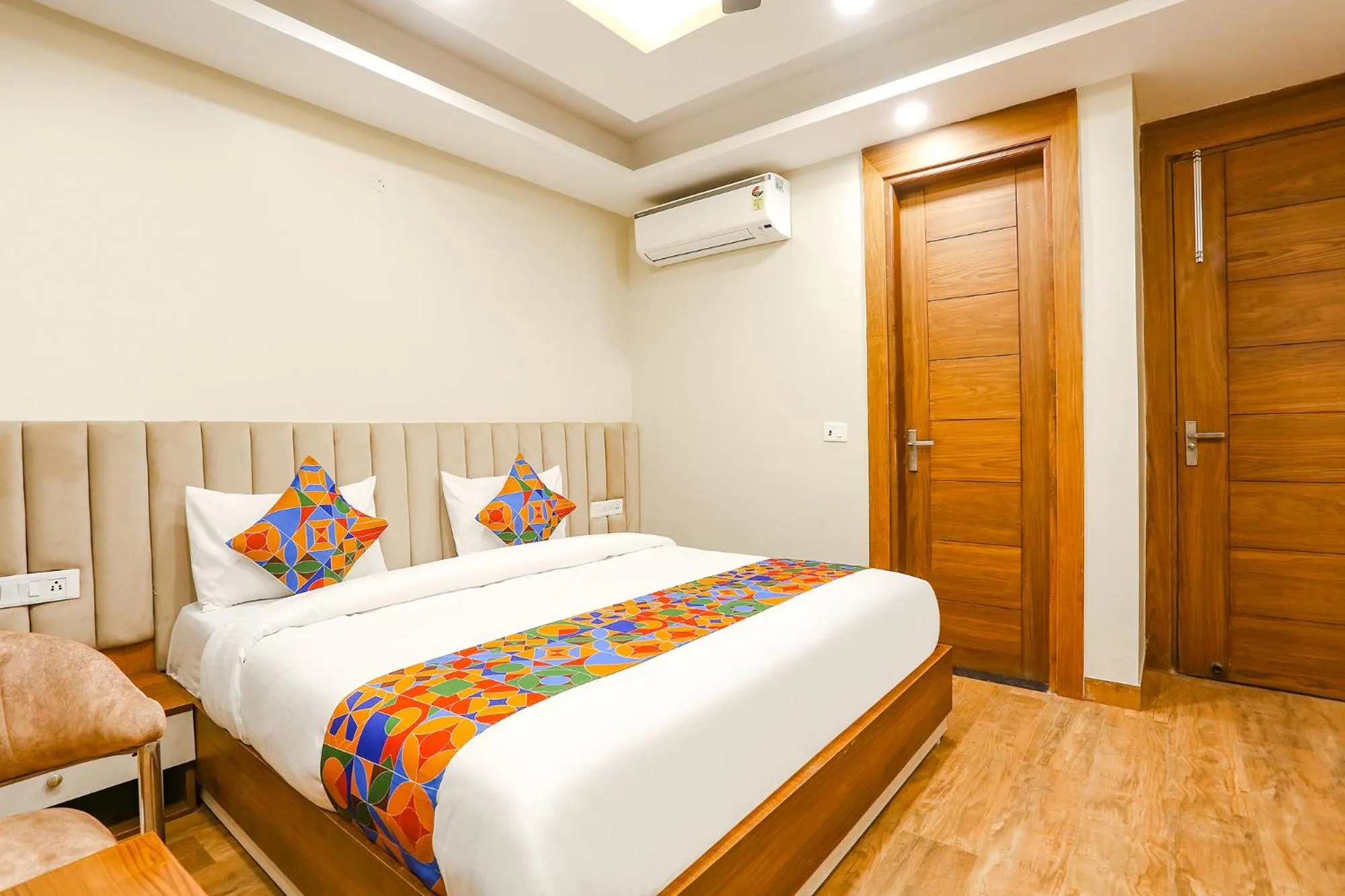 Living room, Bed in FabHotel Raahi Retreat - Nr Star Mall & 32nd Avenue