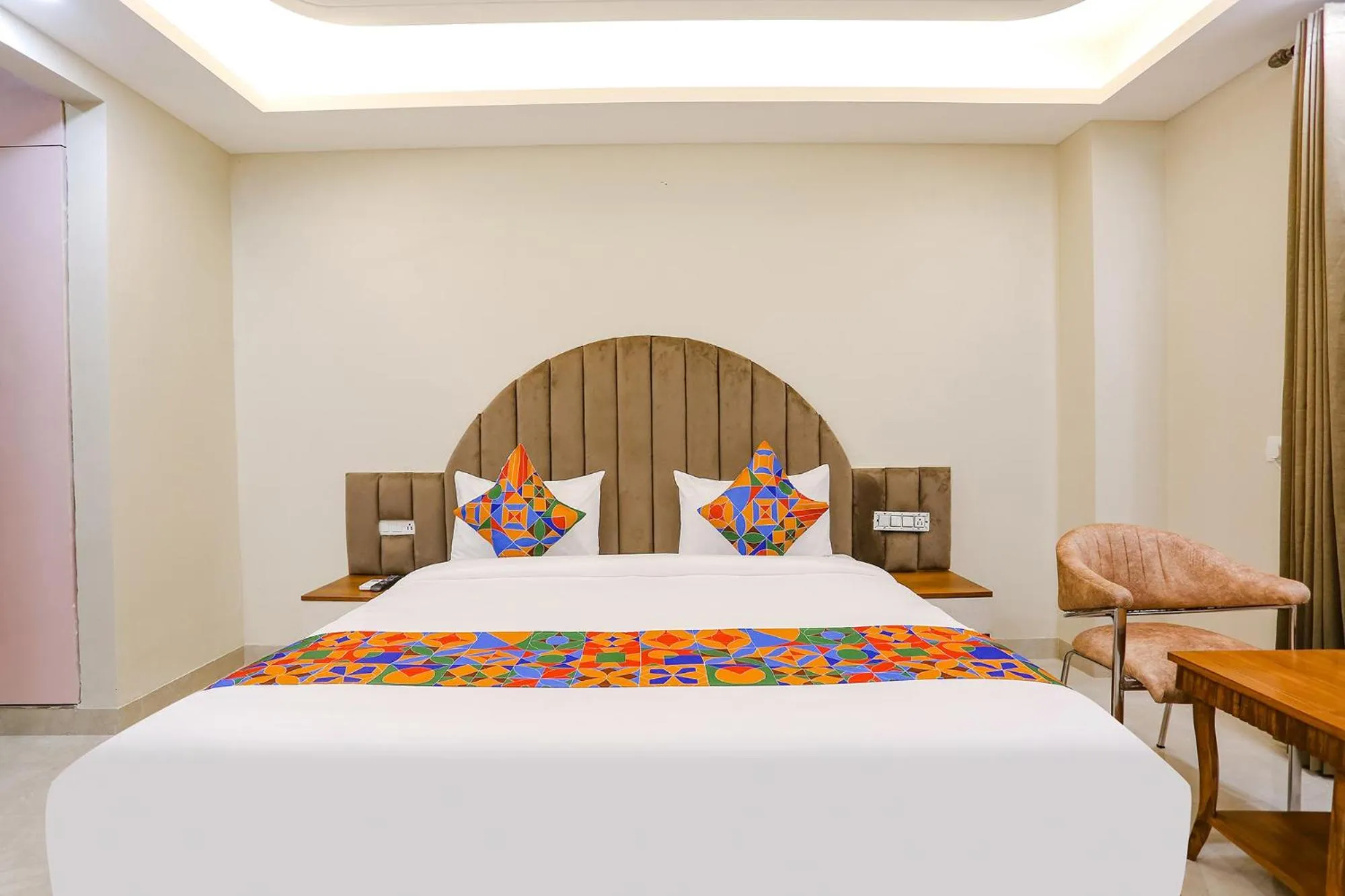 Bed in FabHotel Raahi Retreat - Nr Star Mall & 32nd Avenue