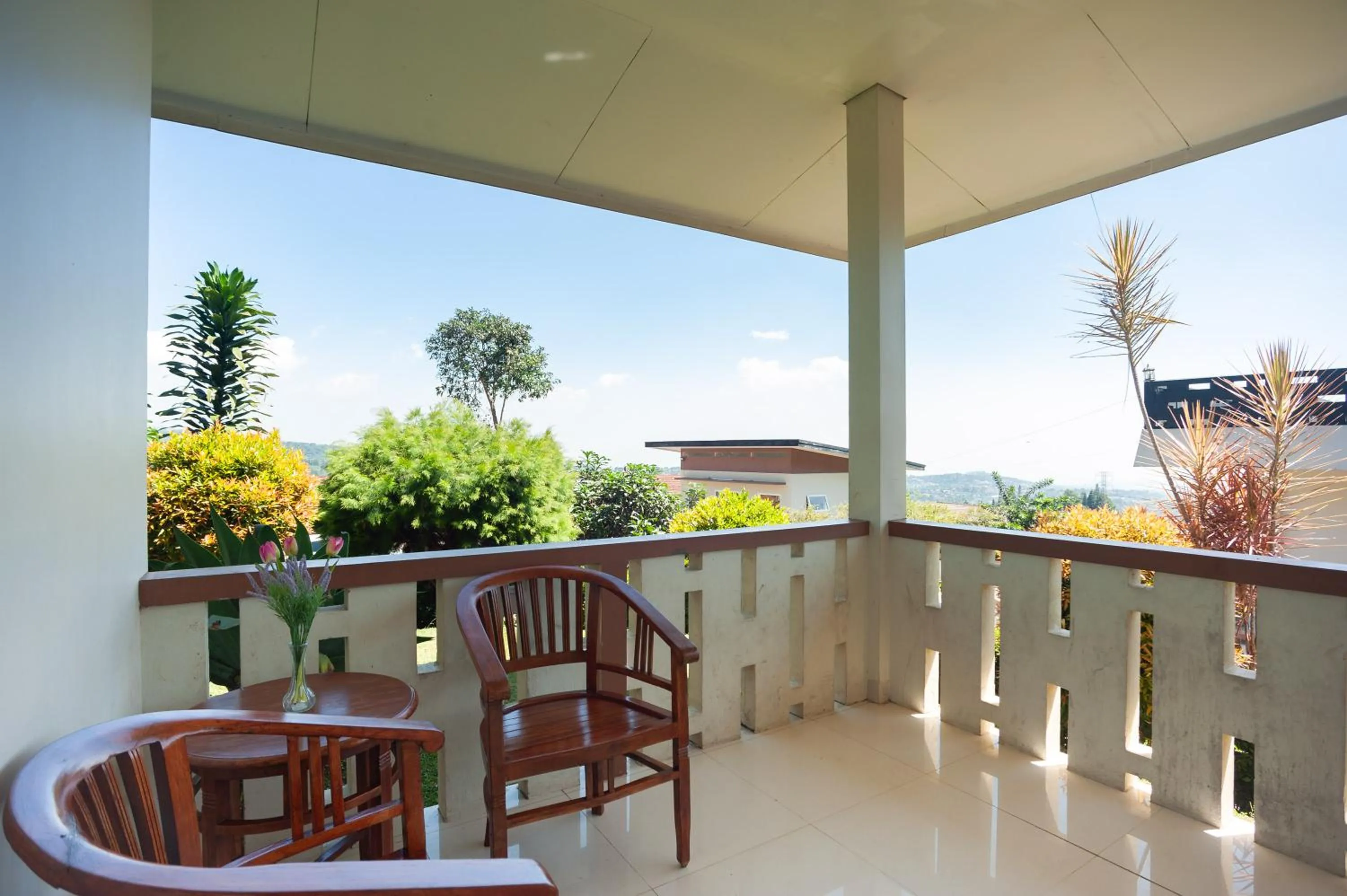 Seating area in Urbanview Resort Adang Zecky Cisarua Puncak by RedDoorz