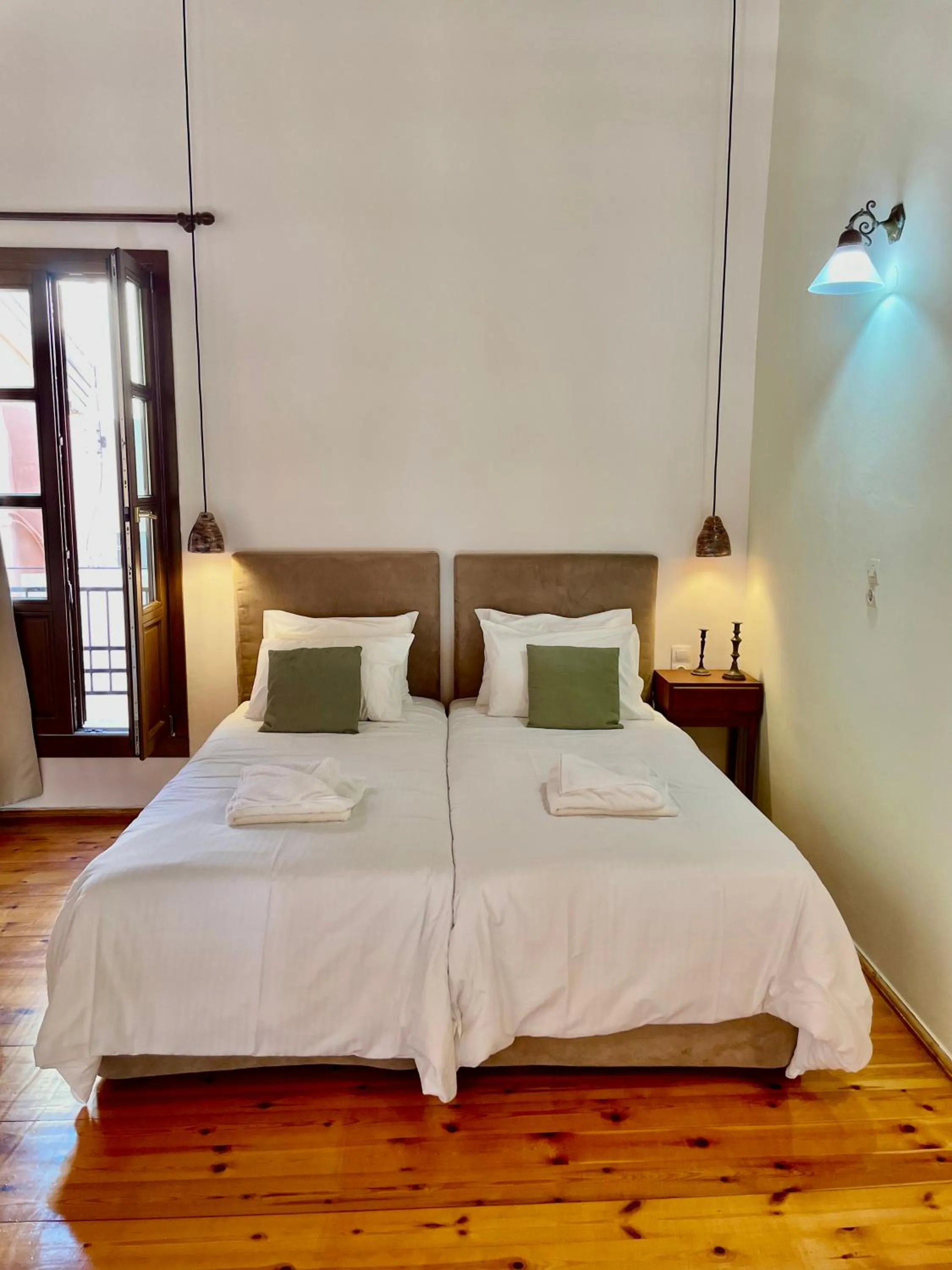 Bed in Erietta Suites