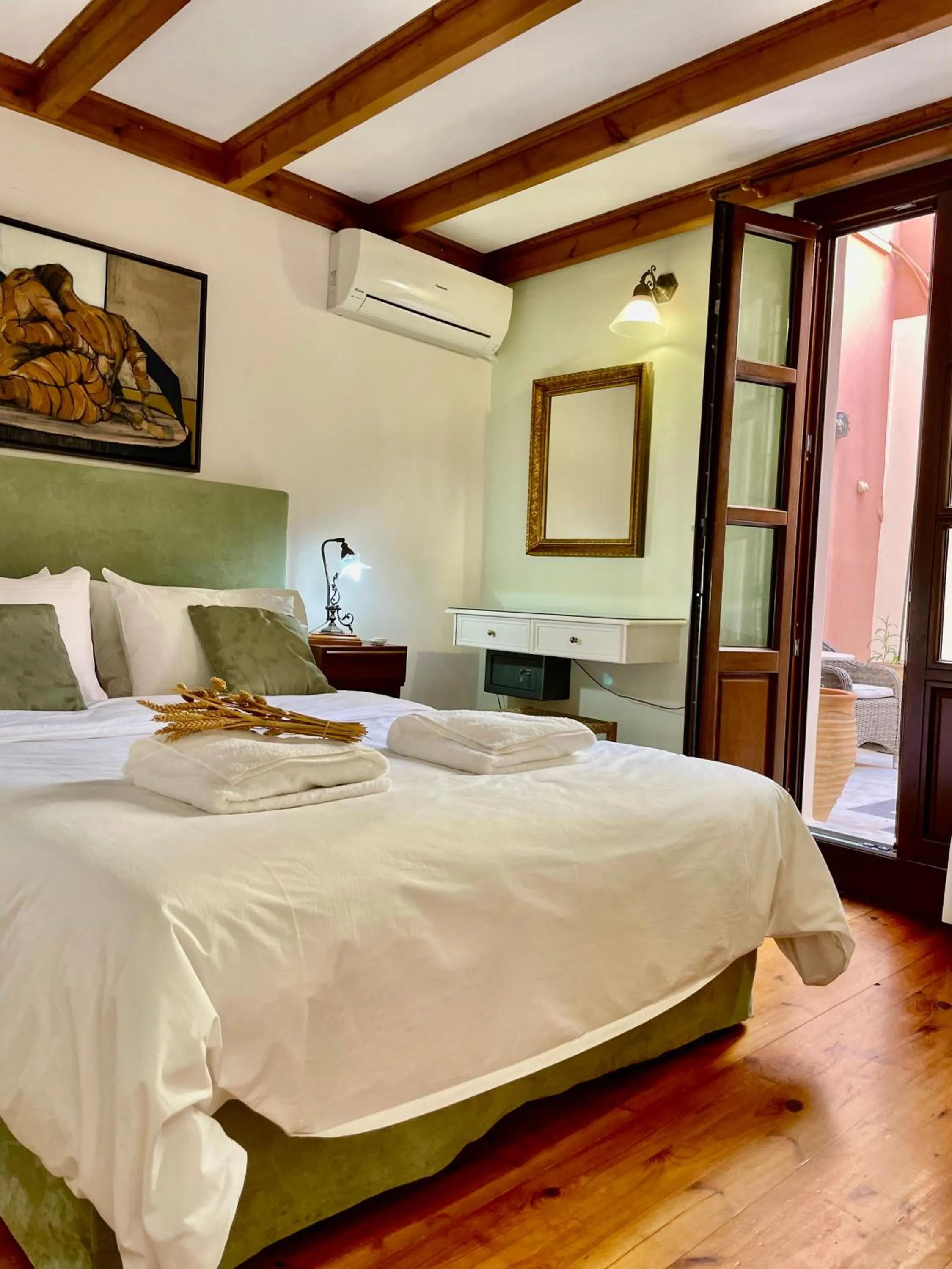 Bed in Erietta Suites