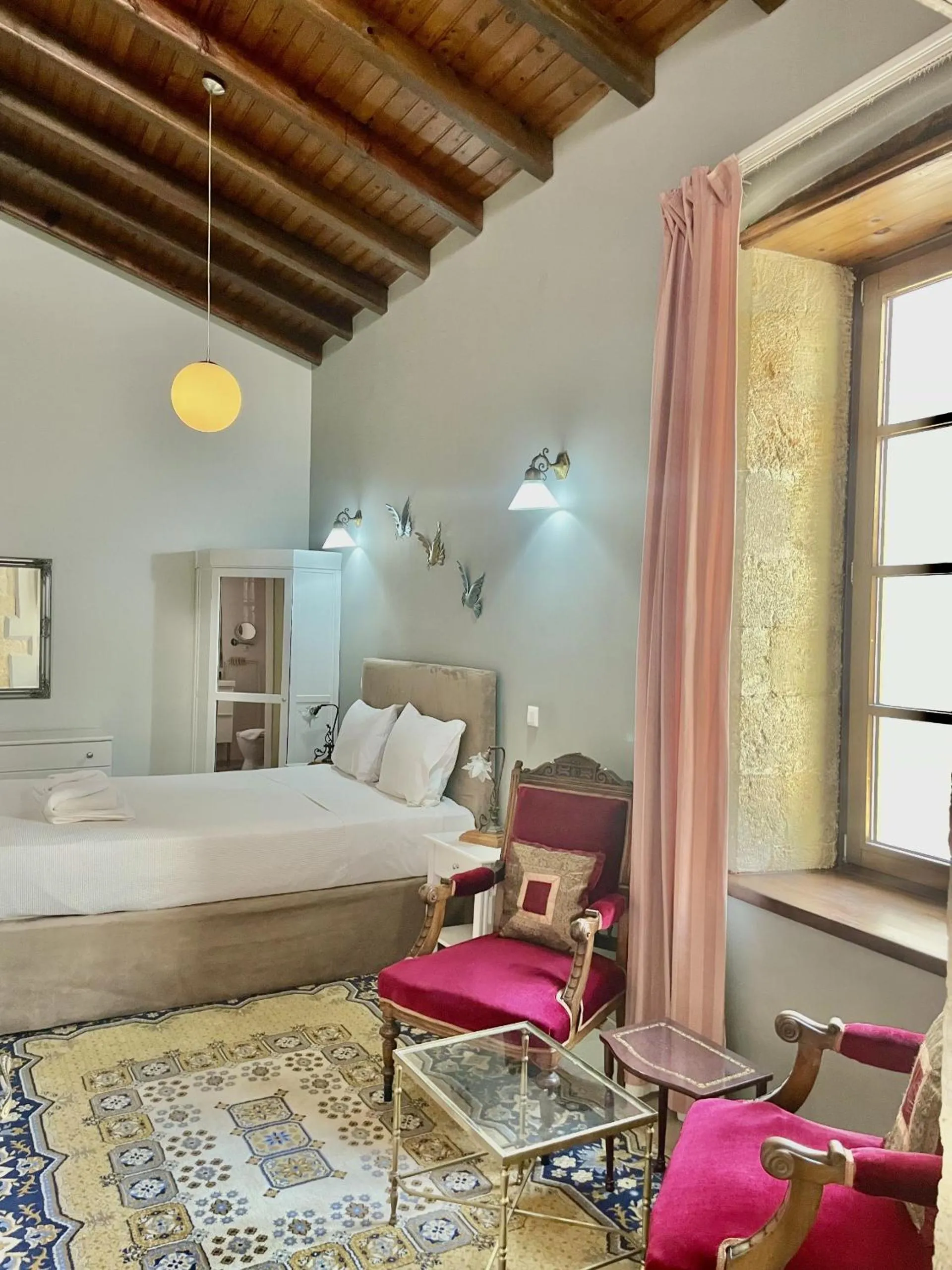 Bed in Erietta Suites