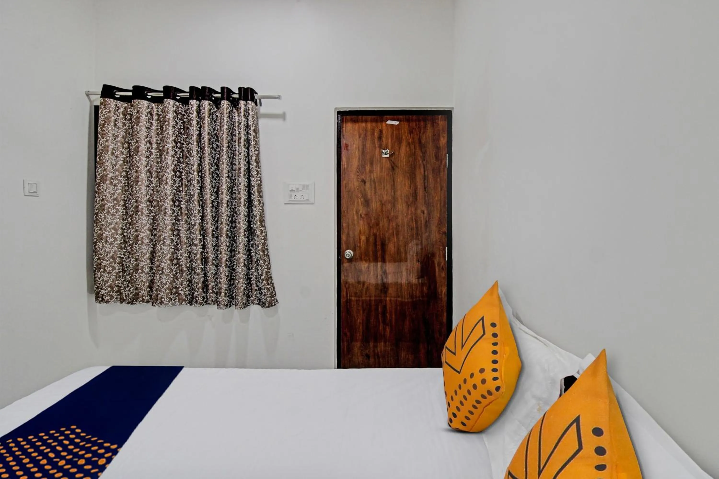 Bedroom in Spot On Tulsi Stay Inn