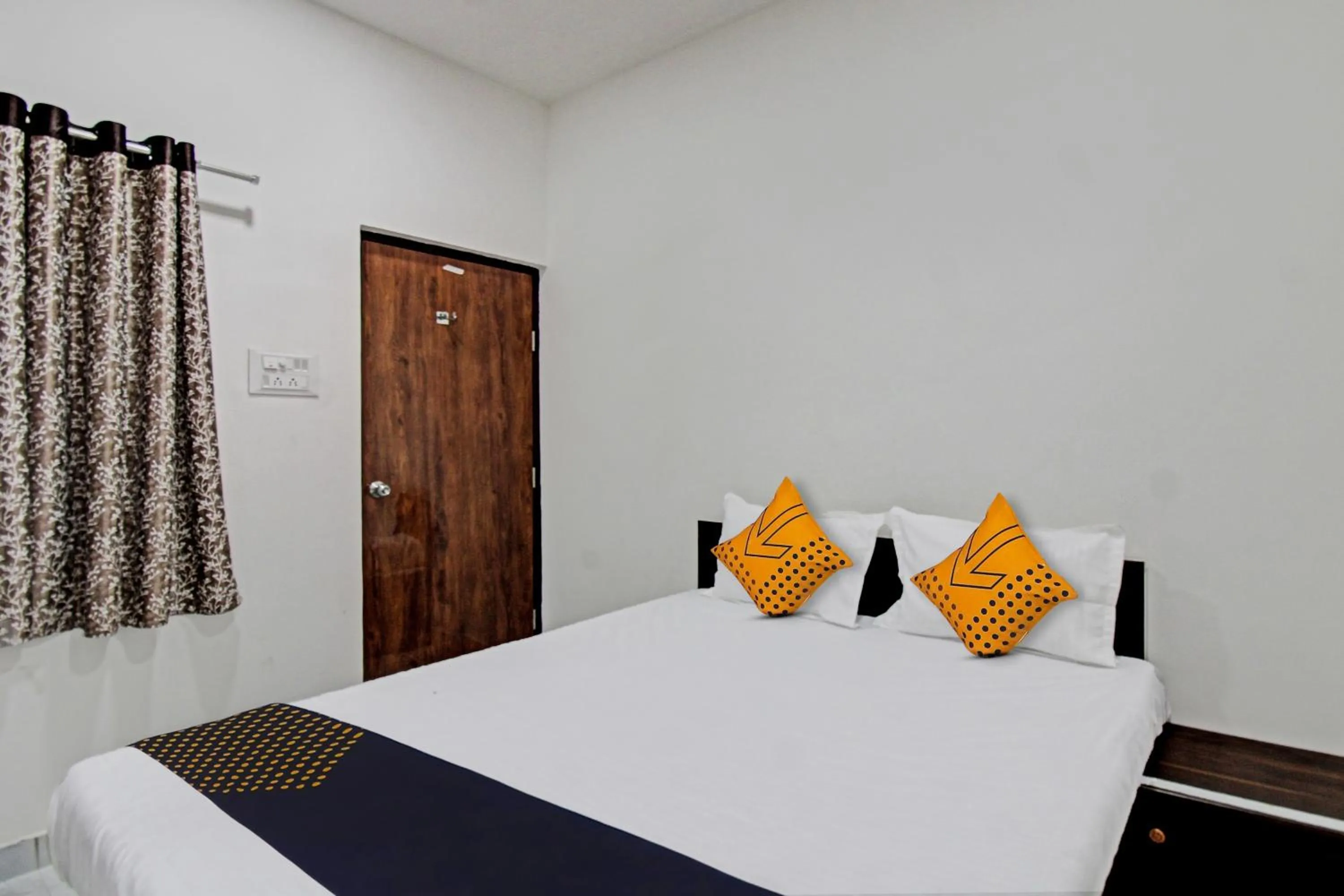 Bedroom in Spot On Tulsi Stay Inn