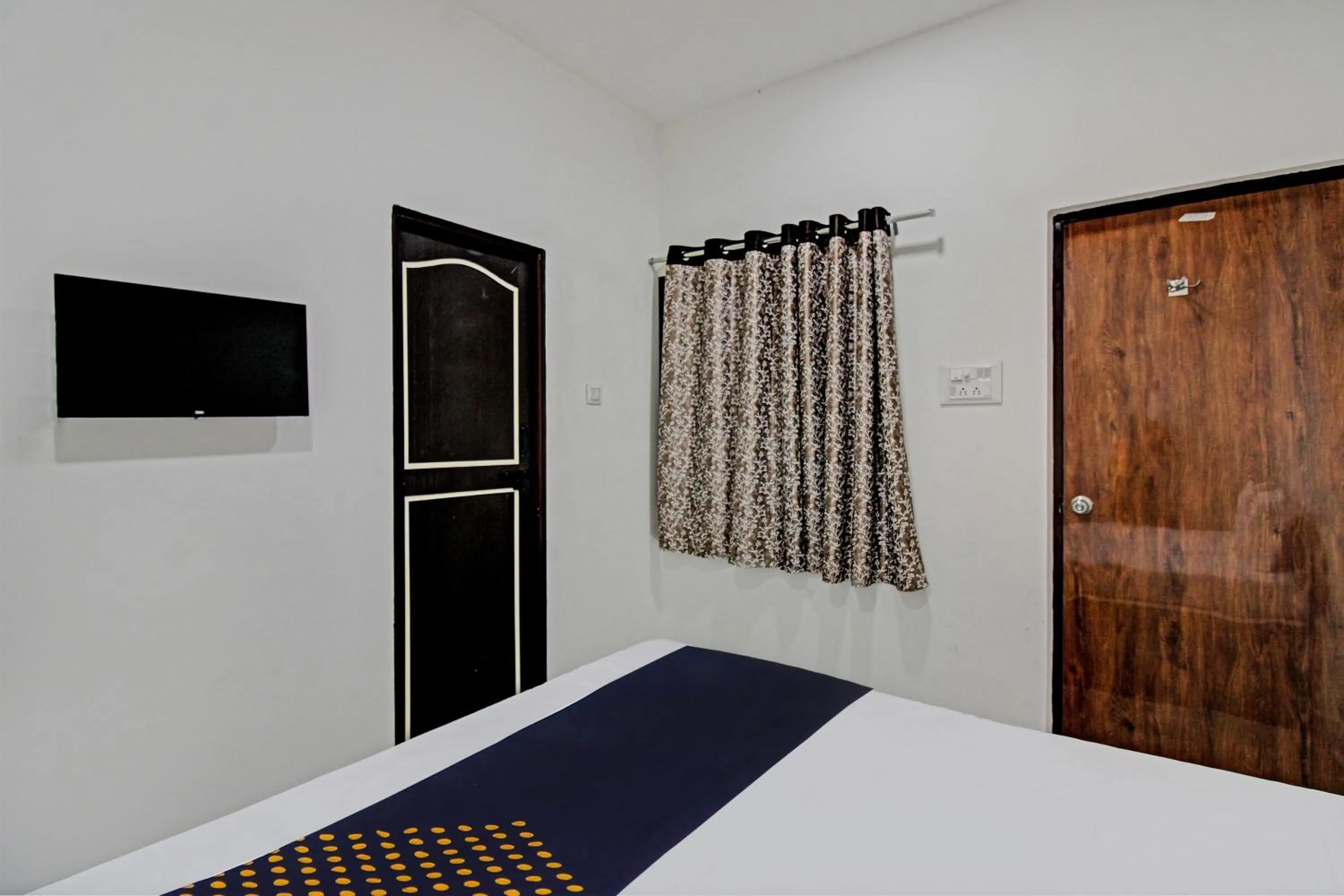 Bedroom in Spot On Tulsi Stay Inn