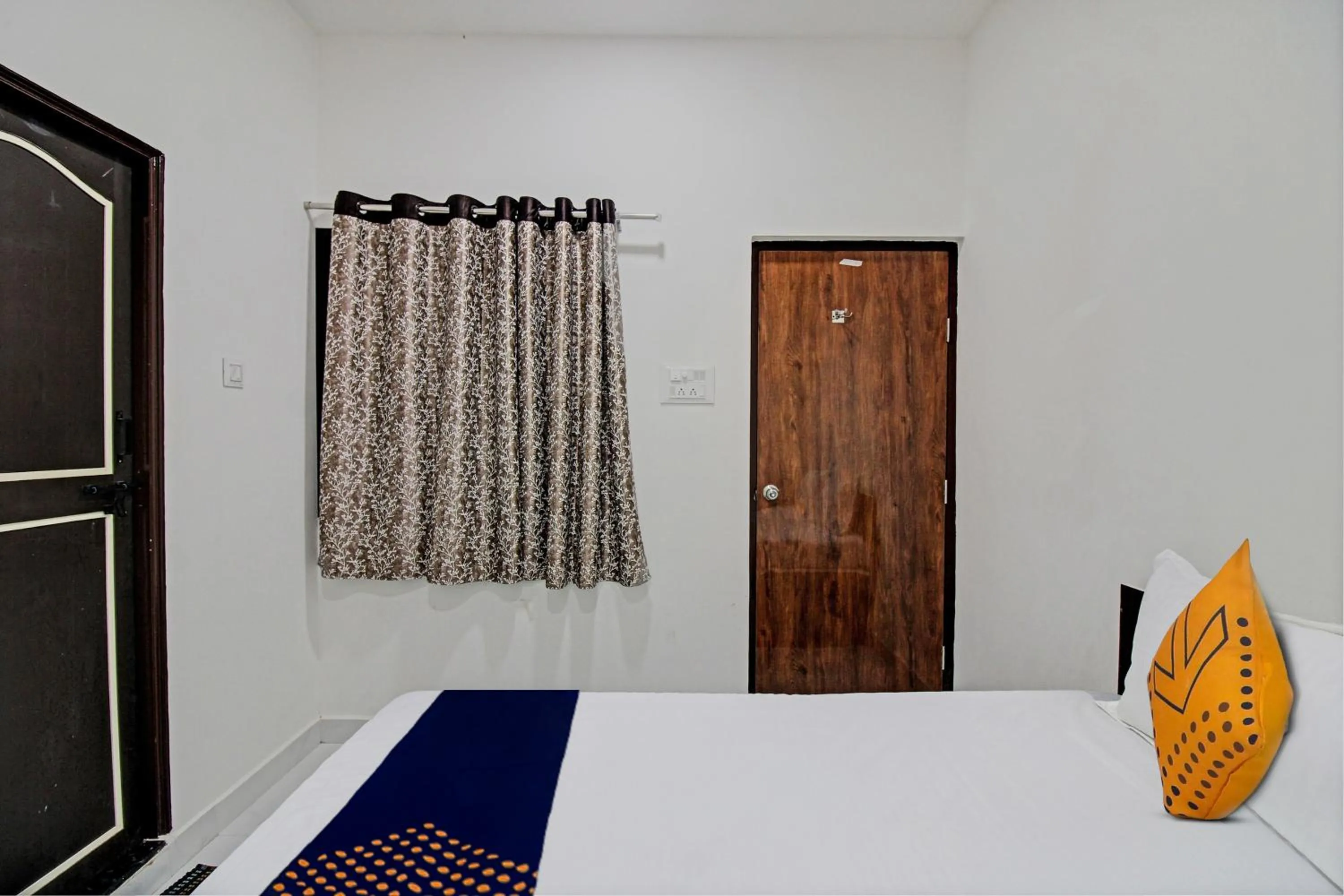 Bedroom in Spot On Tulsi Stay Inn