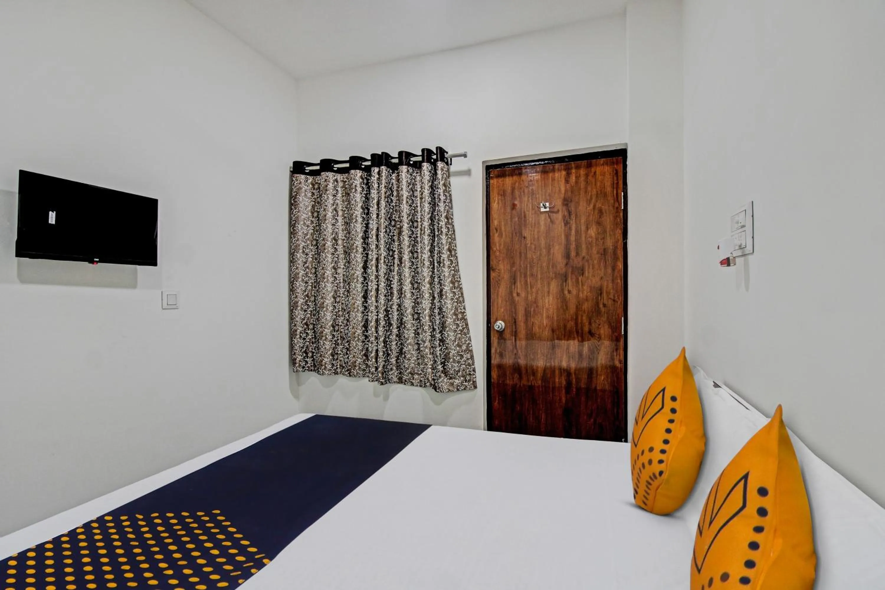 Bedroom in Spot On Tulsi Stay Inn