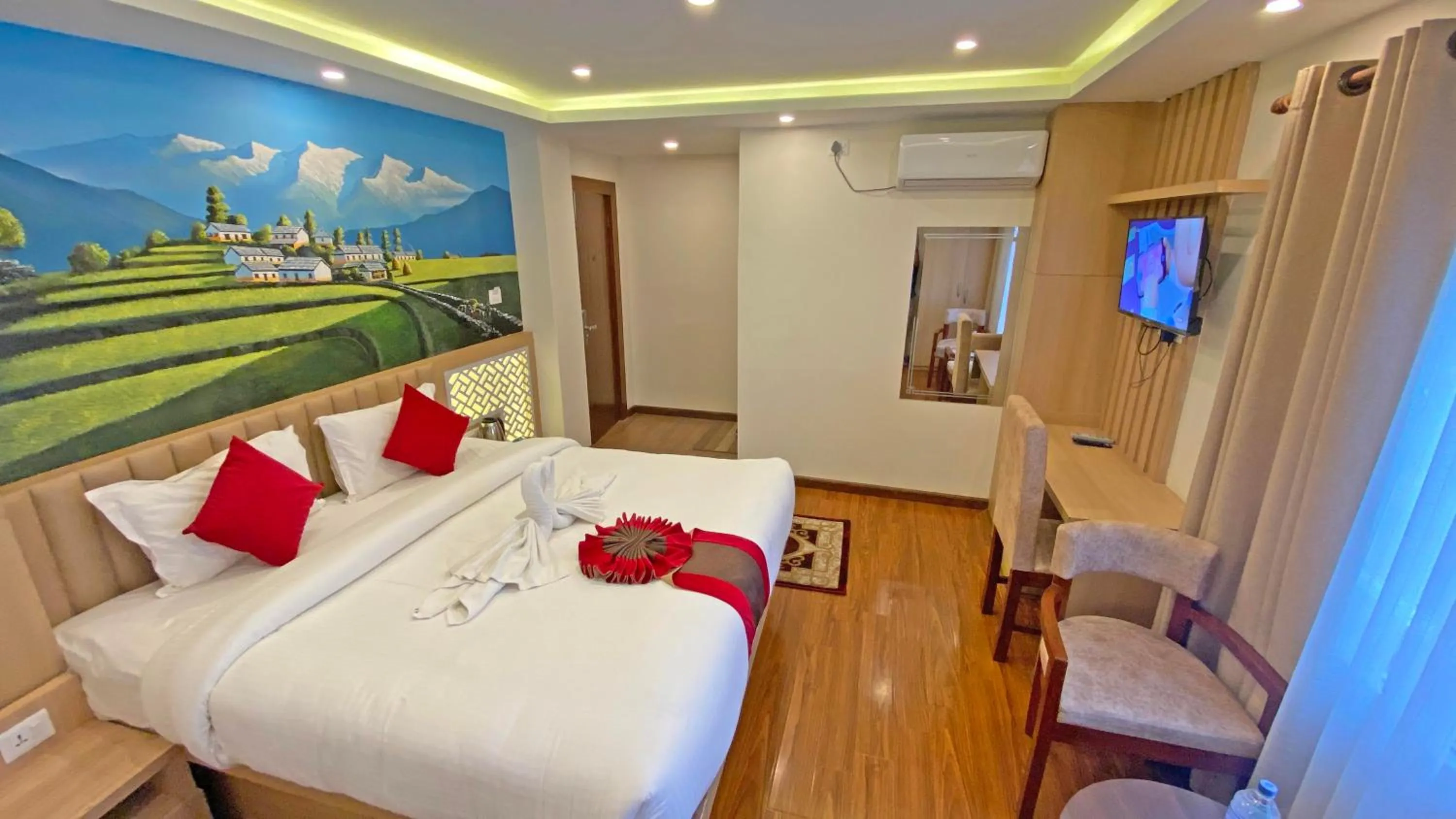 Communal lounge/ TV room, Bed in Hotel Malati