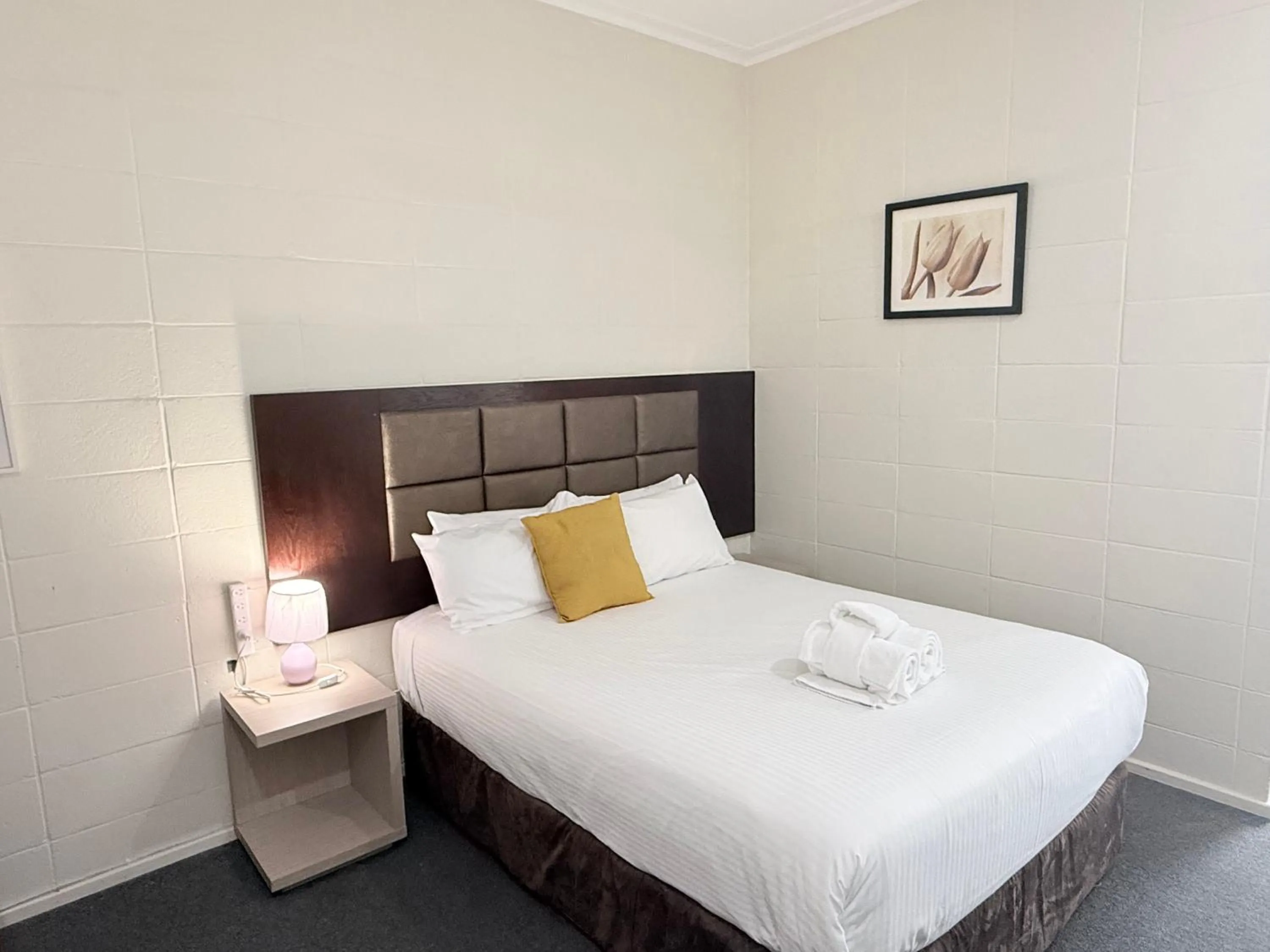 Bed in Coffs Windmill Motel