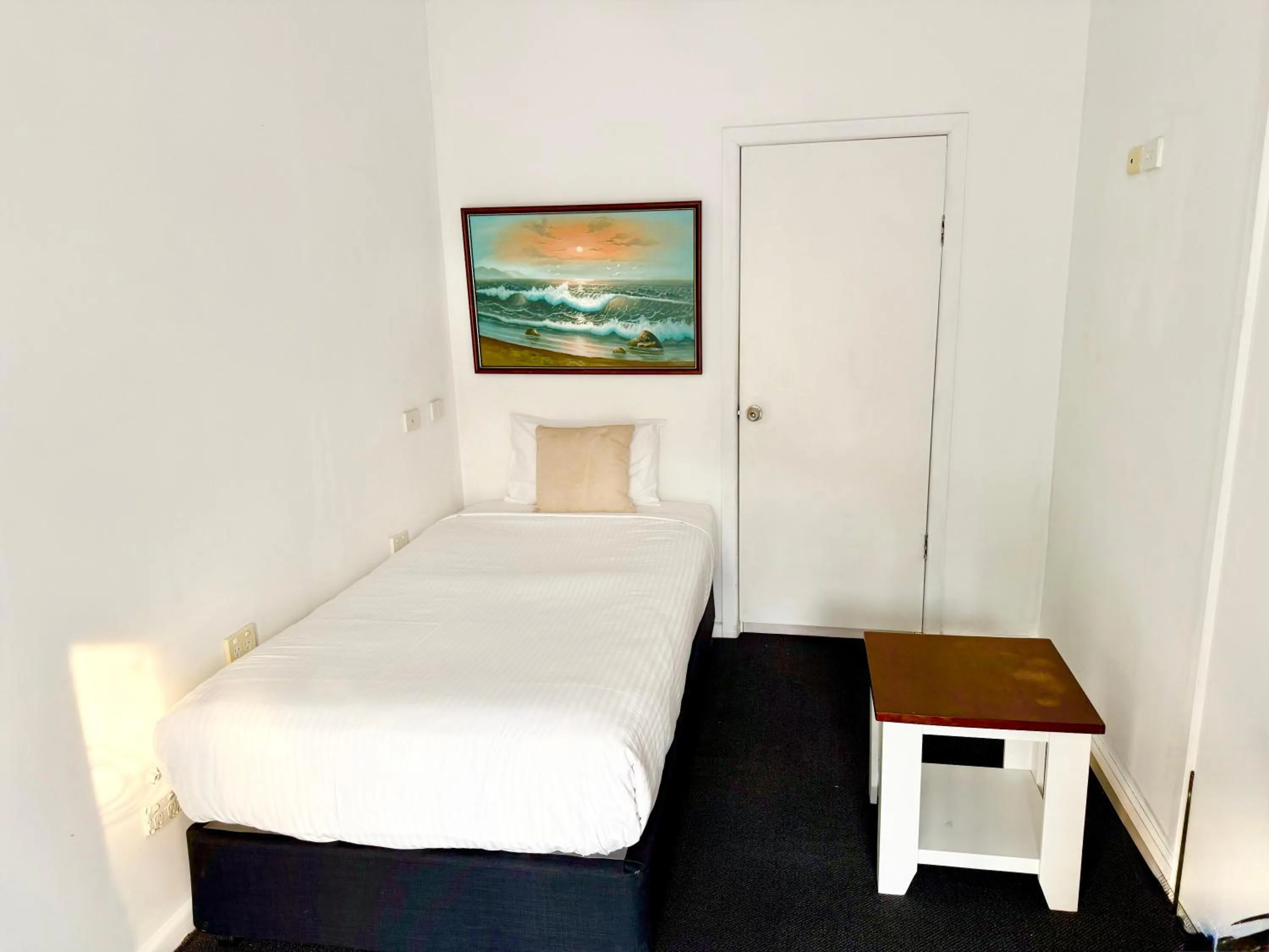 Bed in Coffs Windmill Motel