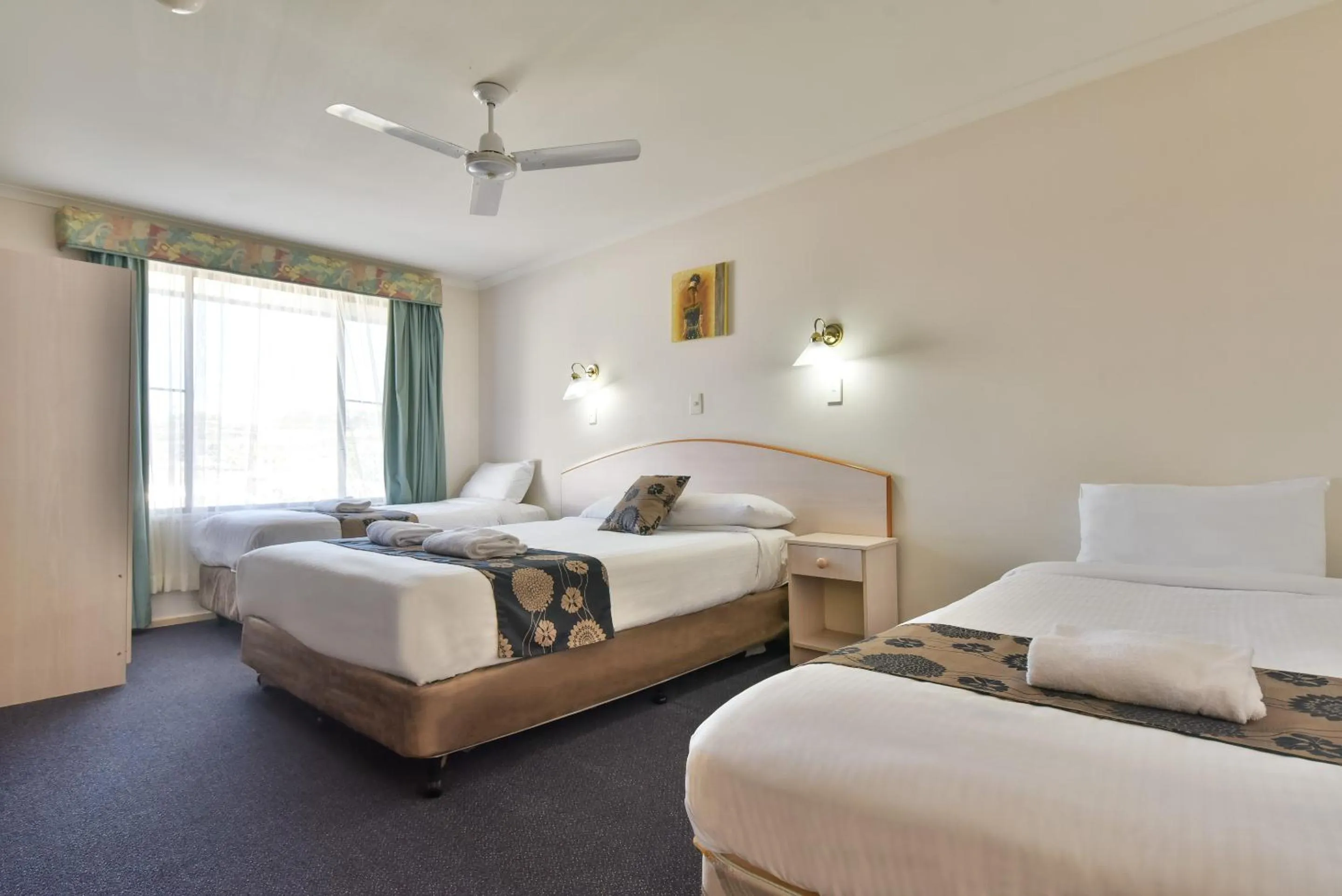 Bed in Coffs Windmill Motel