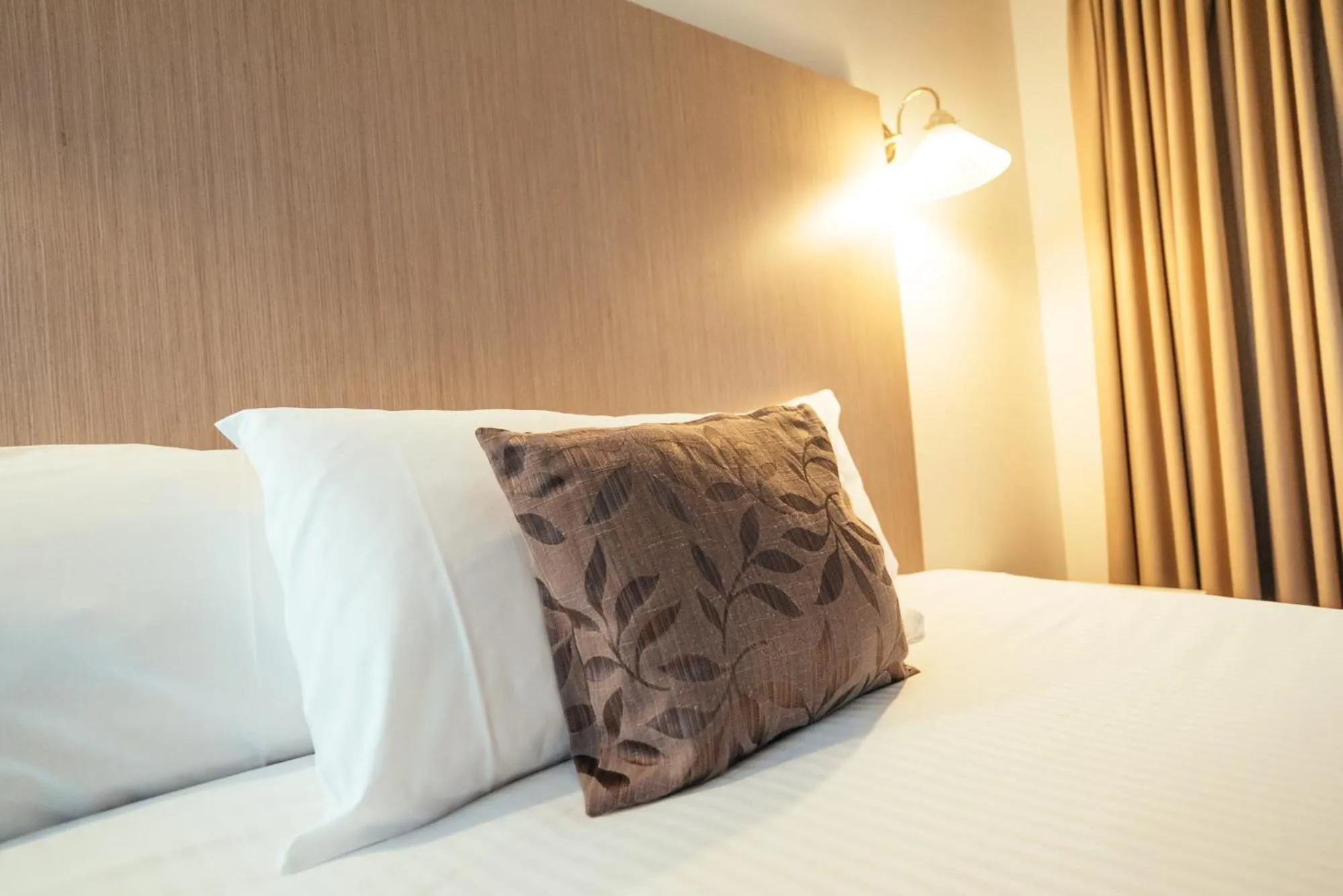 Bed in Coffs Windmill Motel