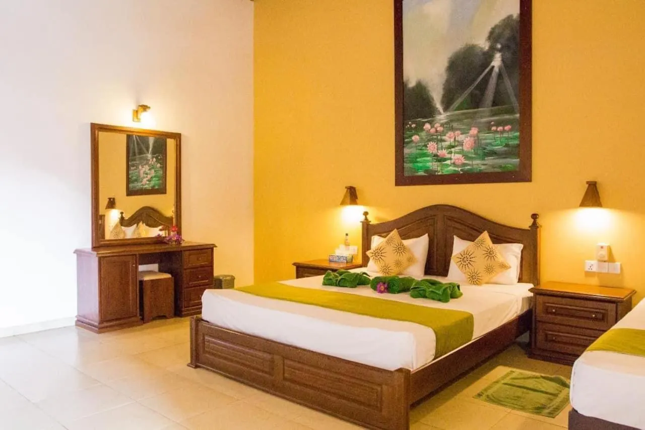 Bed in Jasmin Villa Ayurveda Resort