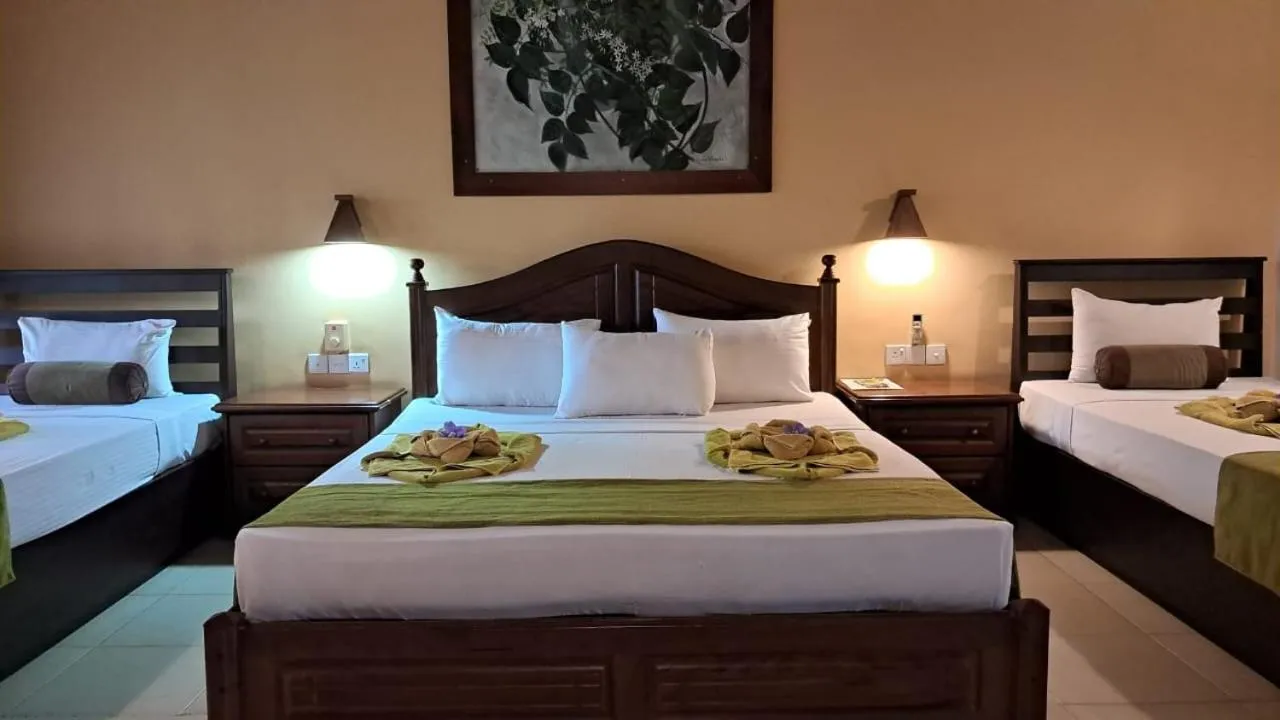 Bed in Jasmin Villa Ayurveda Resort