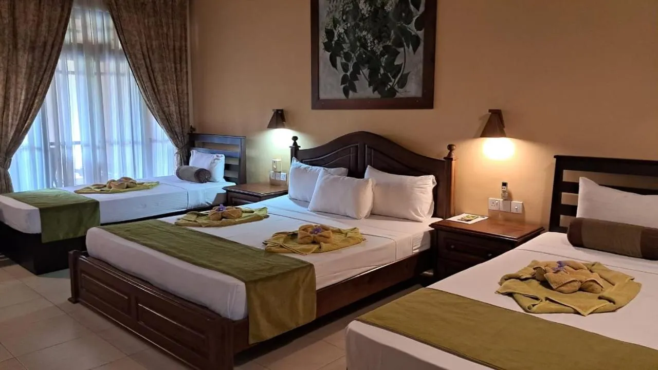 Bed in Jasmin Villa Ayurveda Resort