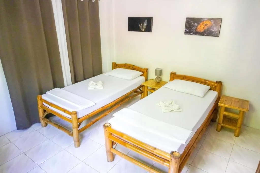Bed in Baki Divers and Beach Resort
