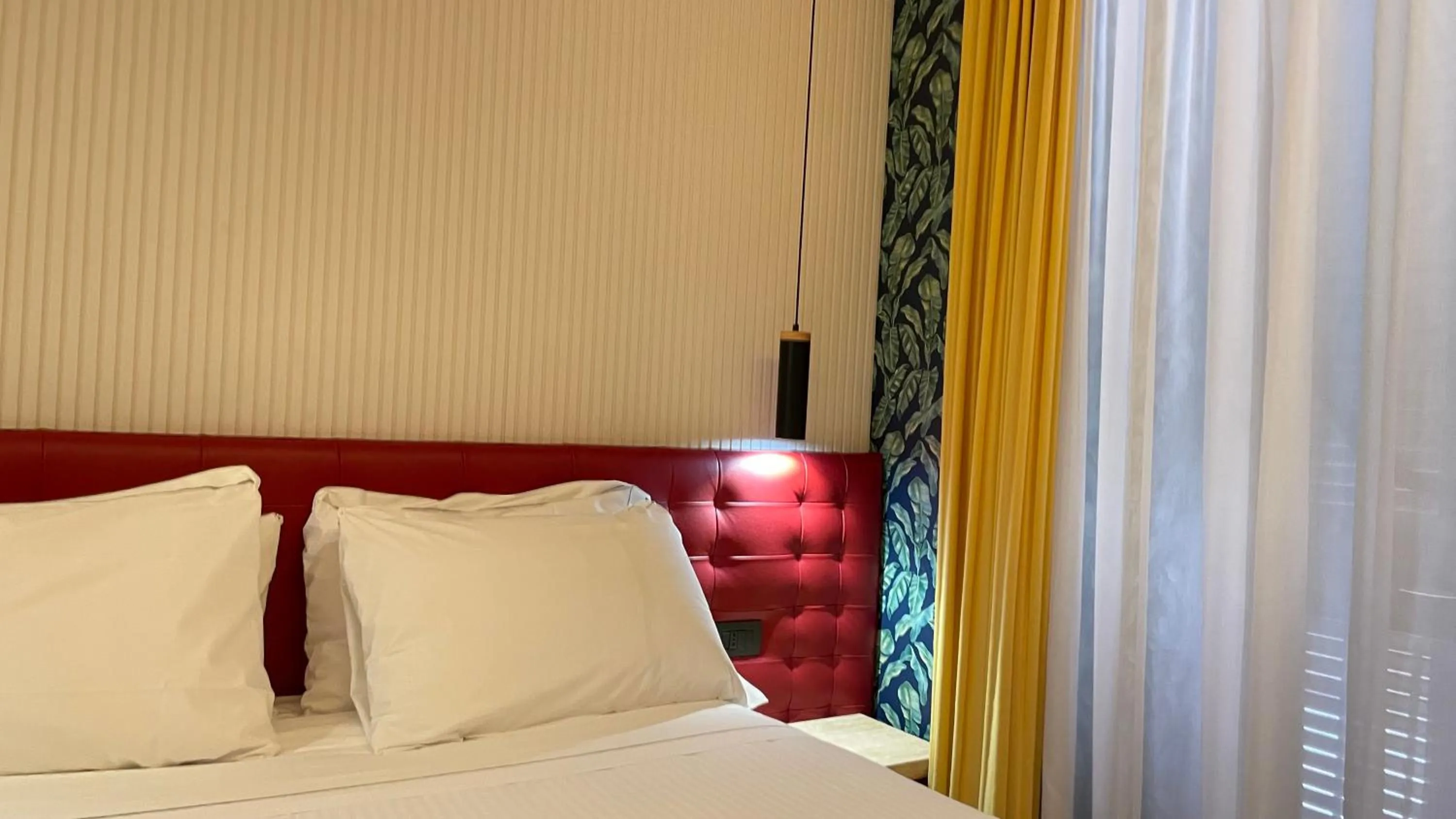 Bed in Passpartout Boutique Palace