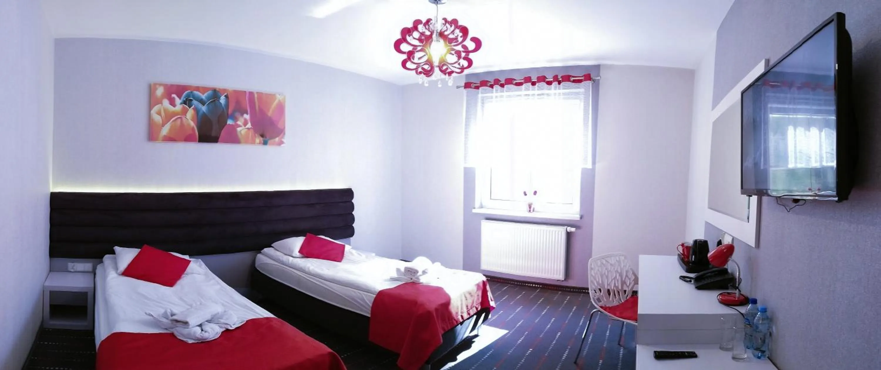 Communal lounge/ TV room, Bed in Hotel Cykada