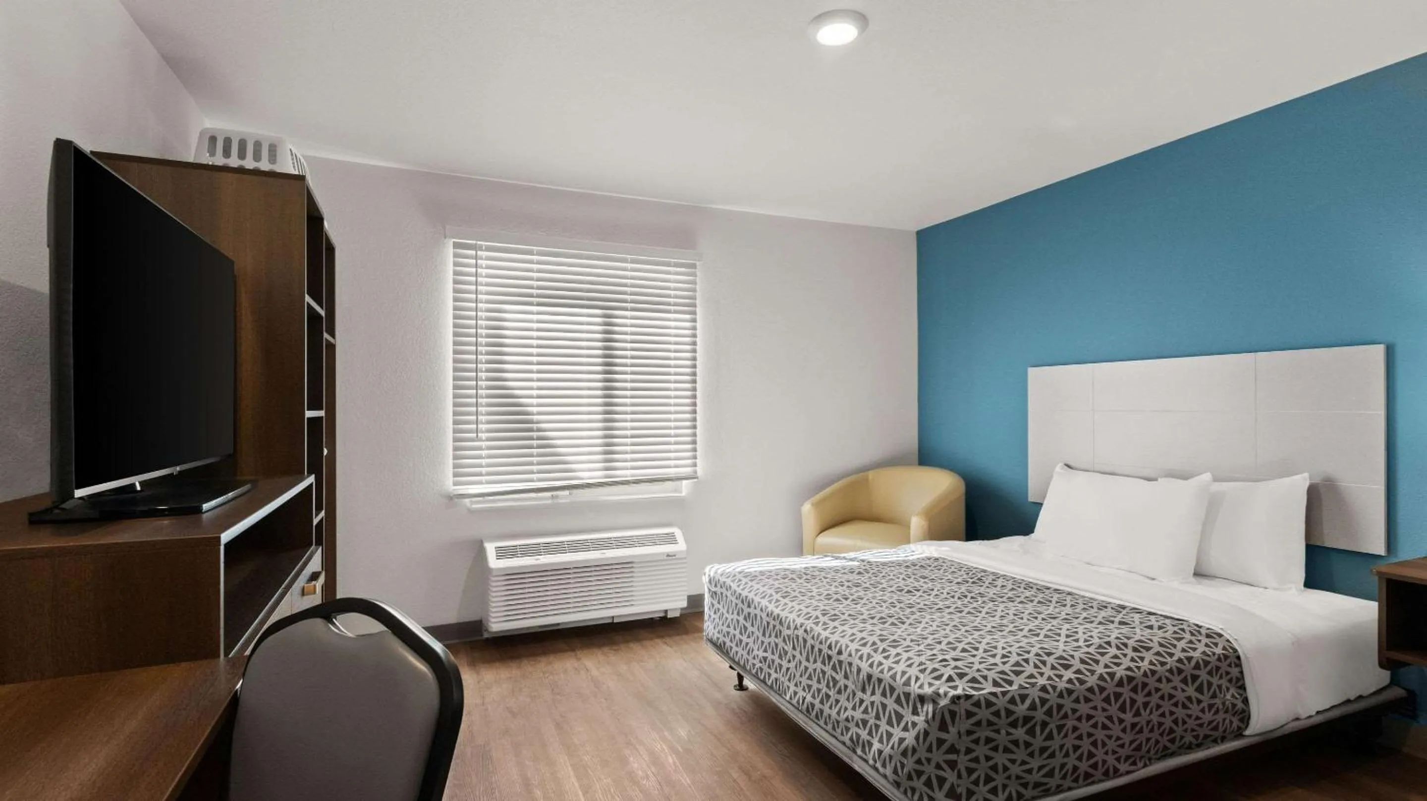 Bedroom, Bed in WoodSpring Suites Greeley