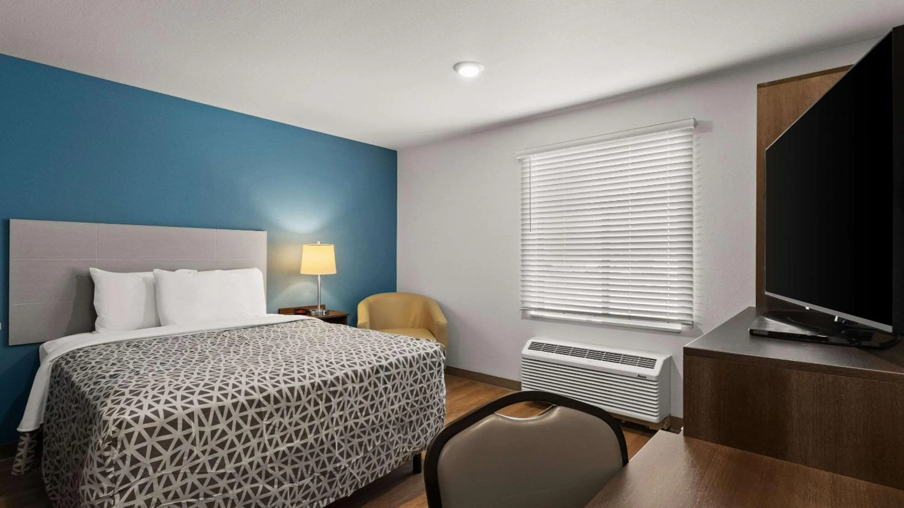 Bedroom, Bed in WoodSpring Suites Greeley