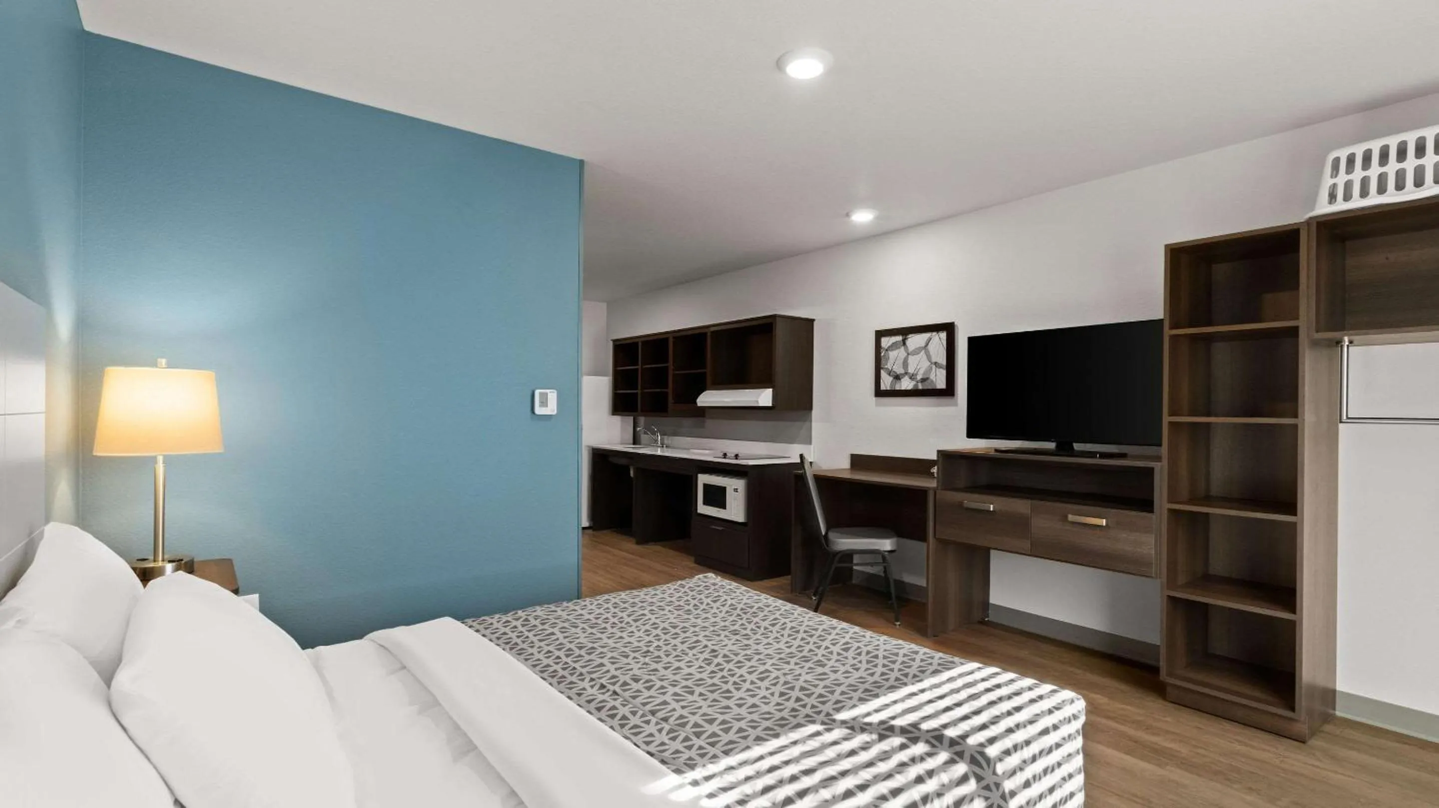 Bedroom, Bed in WoodSpring Suites Greeley